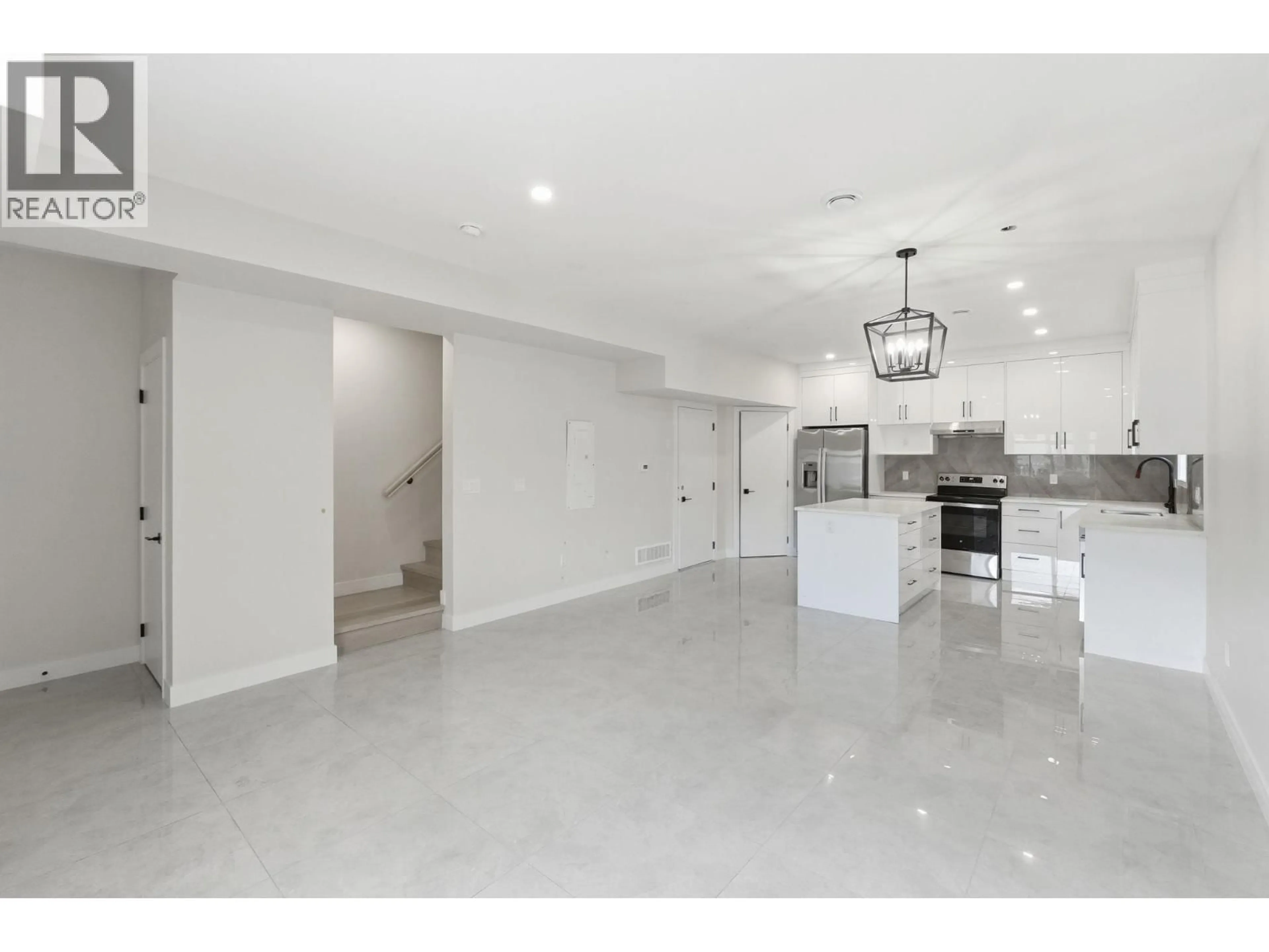 Open concept kitchen, ceramic/tile floor for 4 - 722 COOPLAND CRESCENT, Kelowna British Columbia V1Y2V1