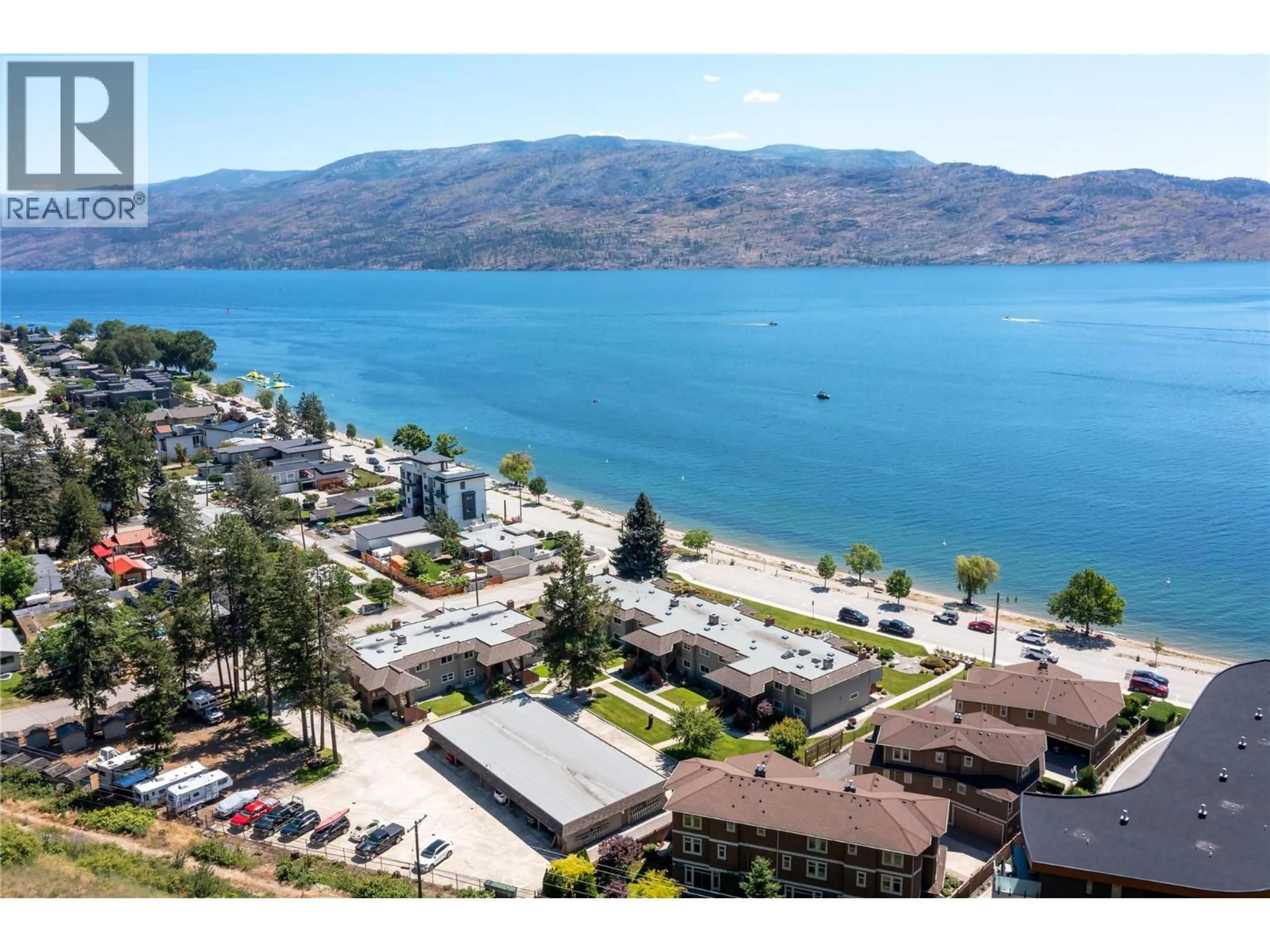 A pic from outside/outdoor area/front of a property/back of a property/a pic from drone, water/lake/river/ocean view for 209 - 4340B BEACH AVENUE, Peachland British Columbia V0H1X6