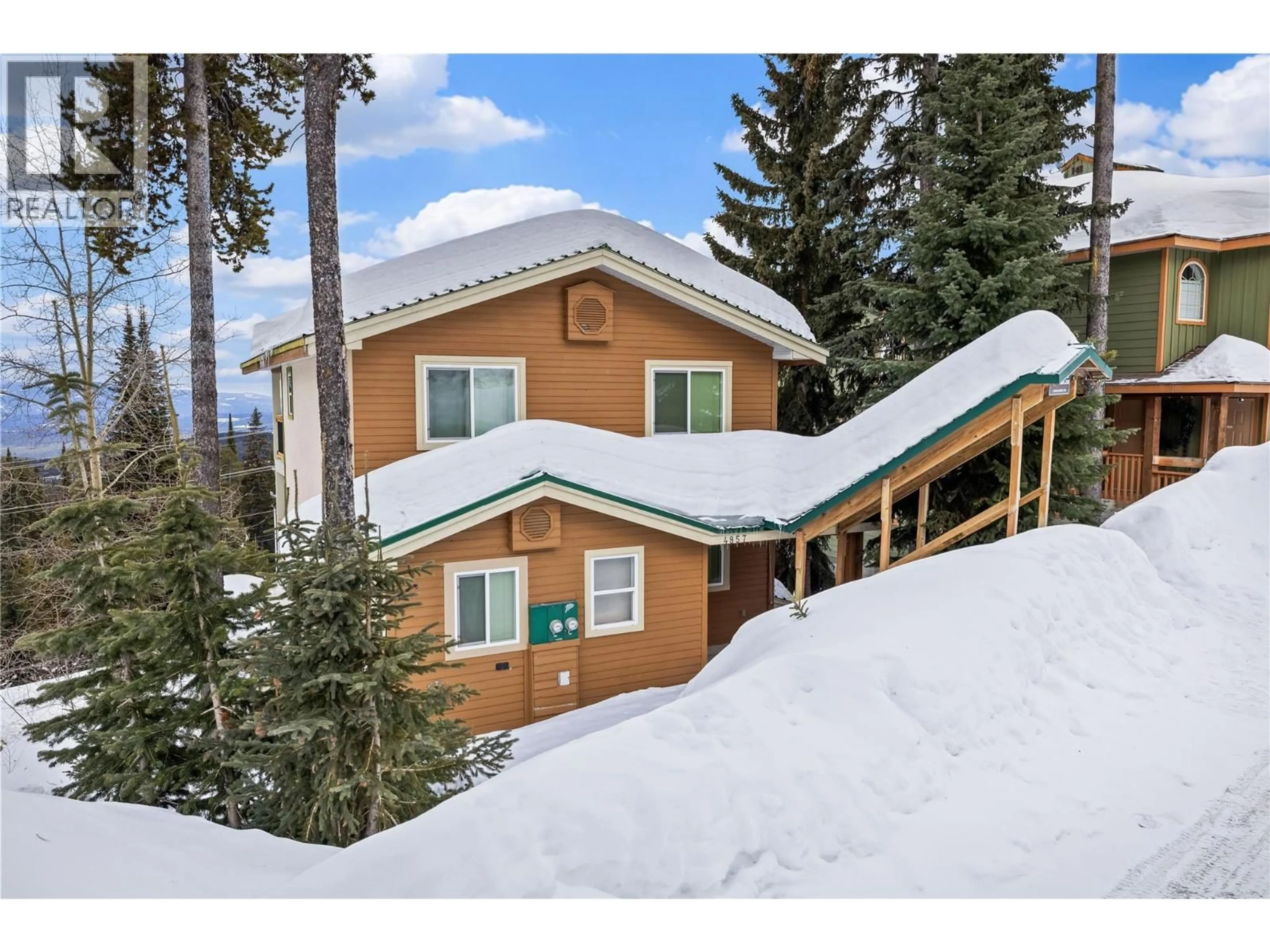 A pic from outside/outdoor area/front of a property/back of a property/a pic from drone, mountain view for 4857 SNOW PINES ROAD, Big White British Columbia V1P1P3