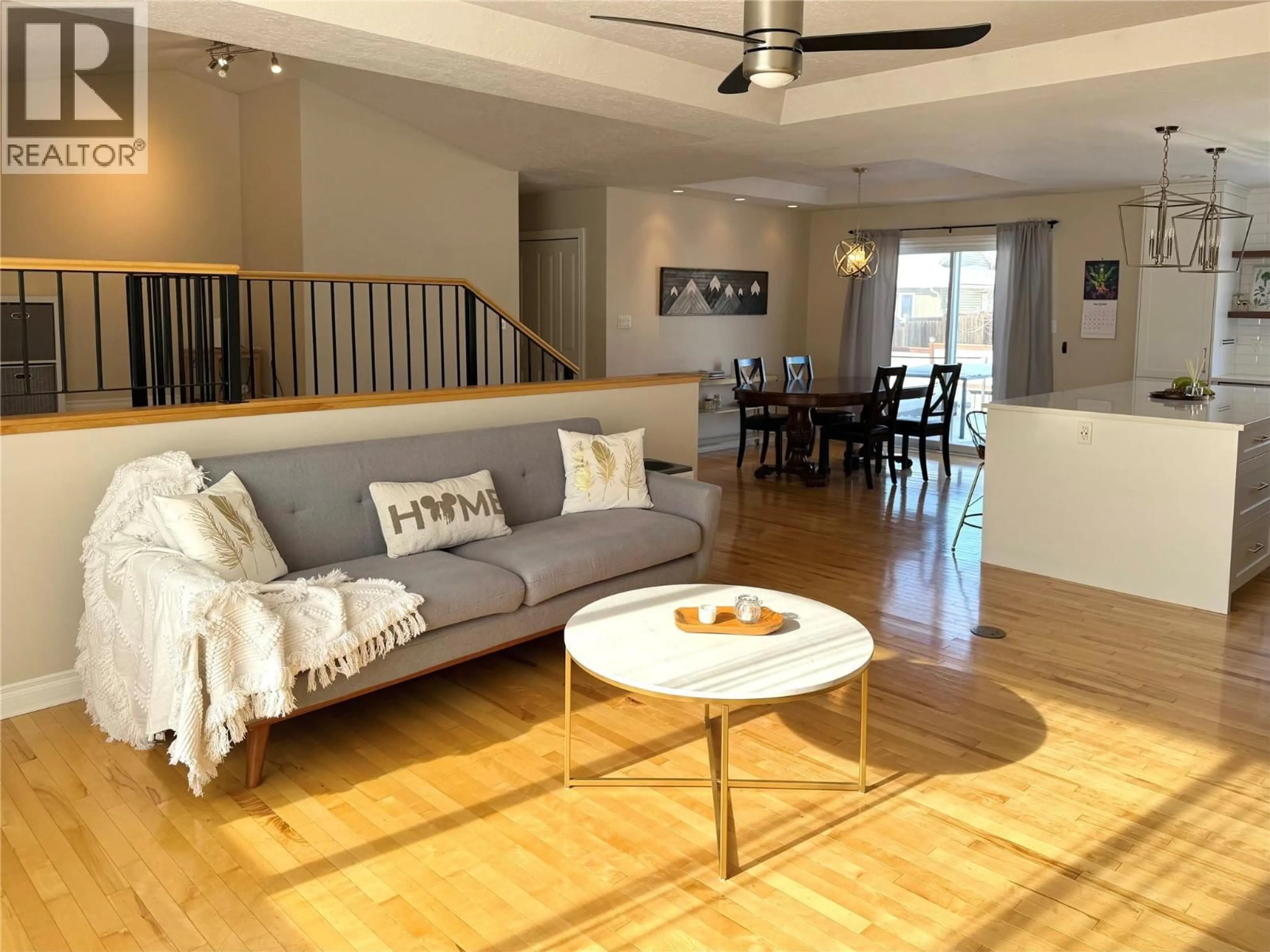 Living room with furniture, wood/laminate floor for 1816 89 AVENUE, Dawson Creek British Columbia V1G5A7