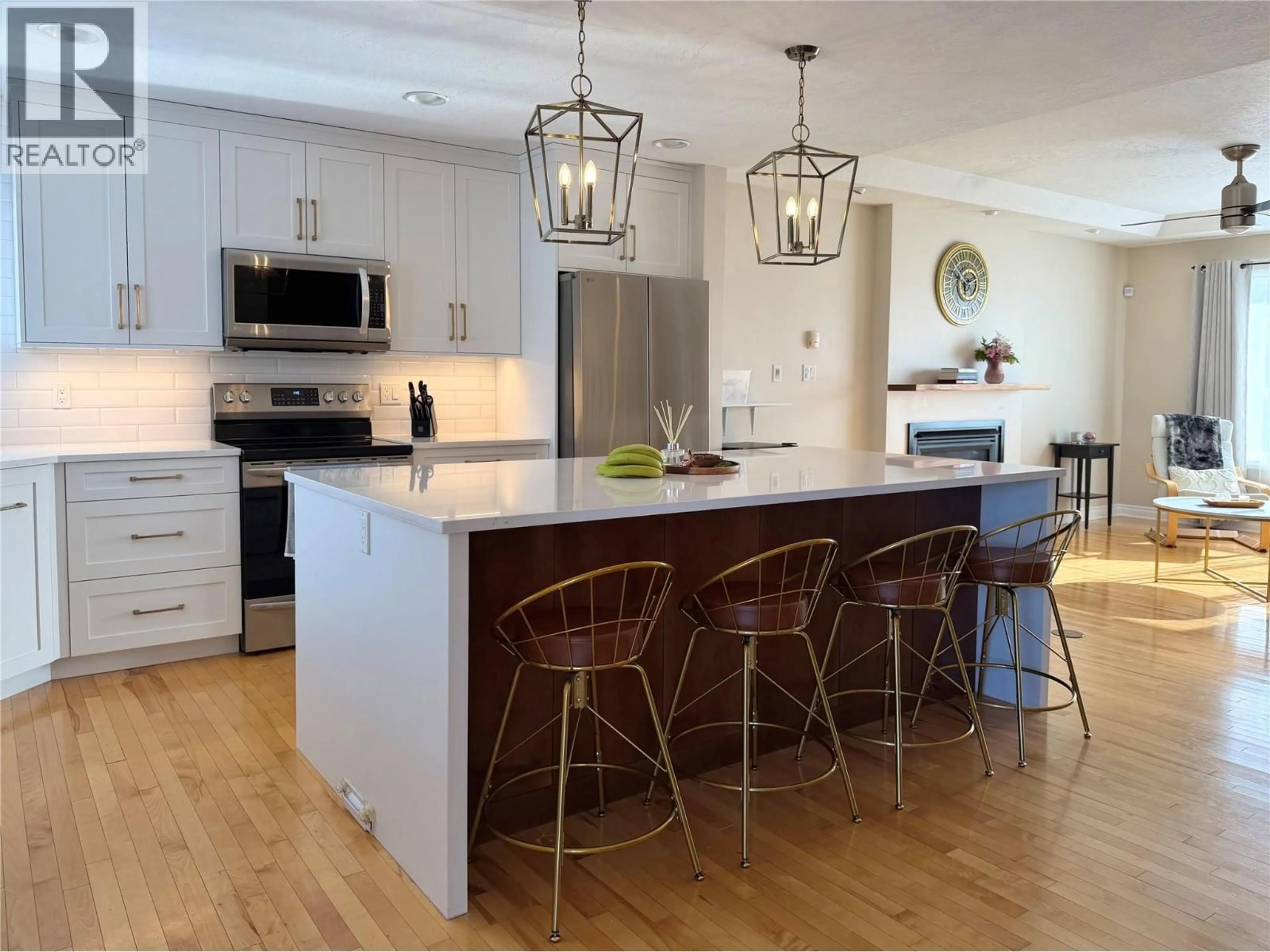 Open concept kitchen, wood/laminate floor for 1816 89 AVENUE, Dawson Creek British Columbia V1G5A7