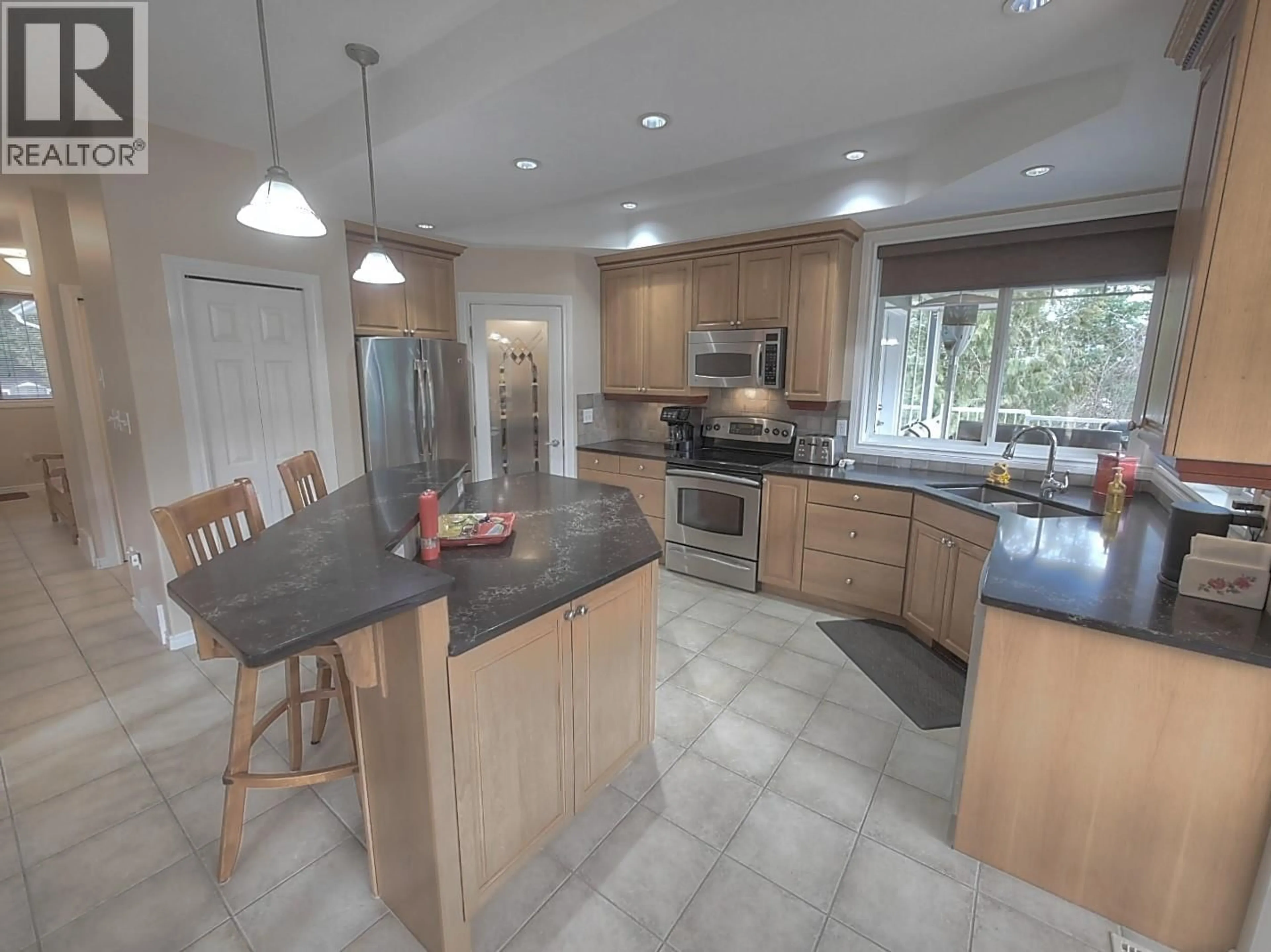 Open concept kitchen, ceramic/tile floor for 408 BALFOUR HEIGHTS ROAD, Balfour British Columbia V0G1C0