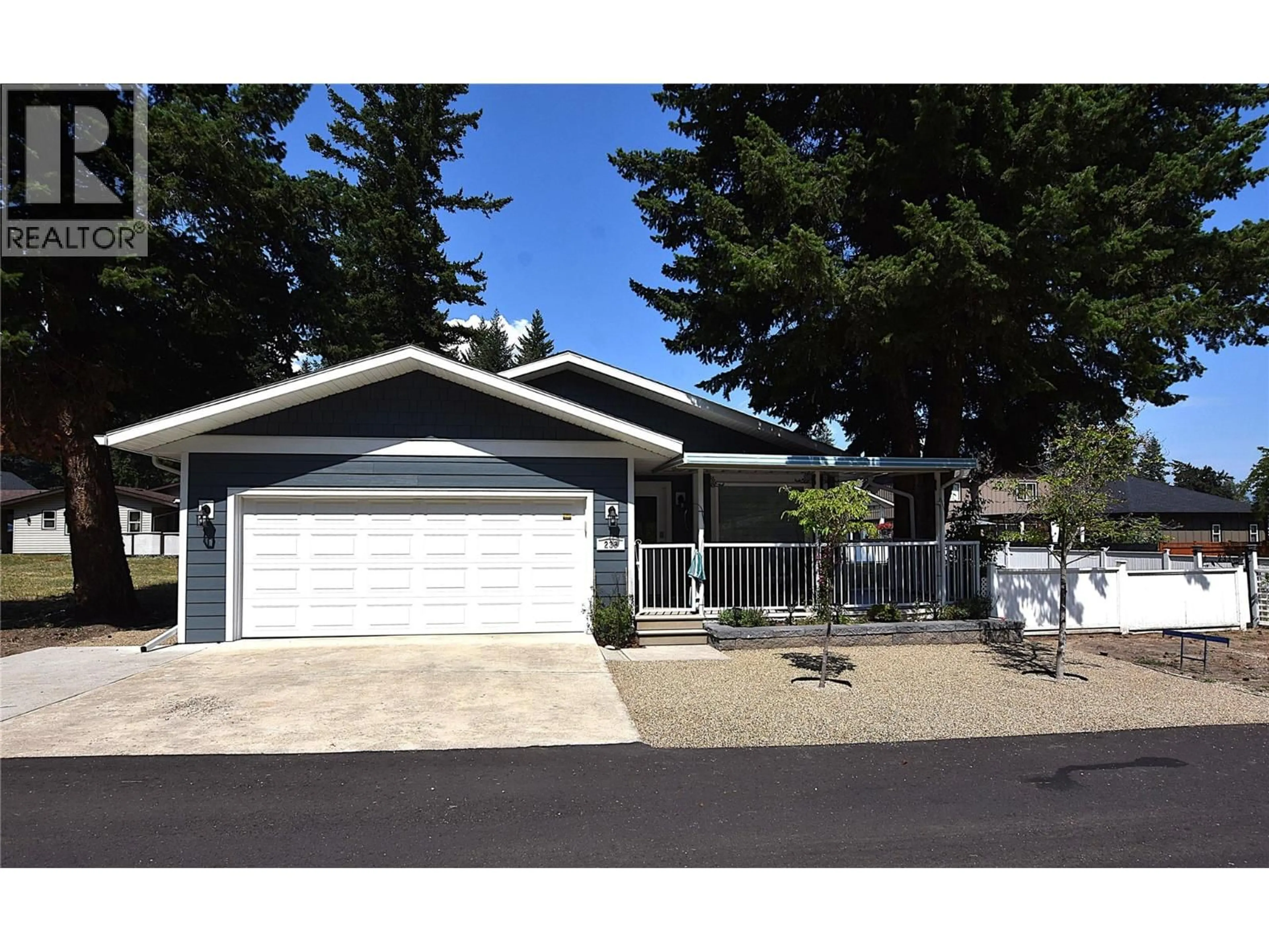 Home with vinyl exterior material, street for 233 234 FALCON AVENUE, Vernon British Columbia V1H2A1