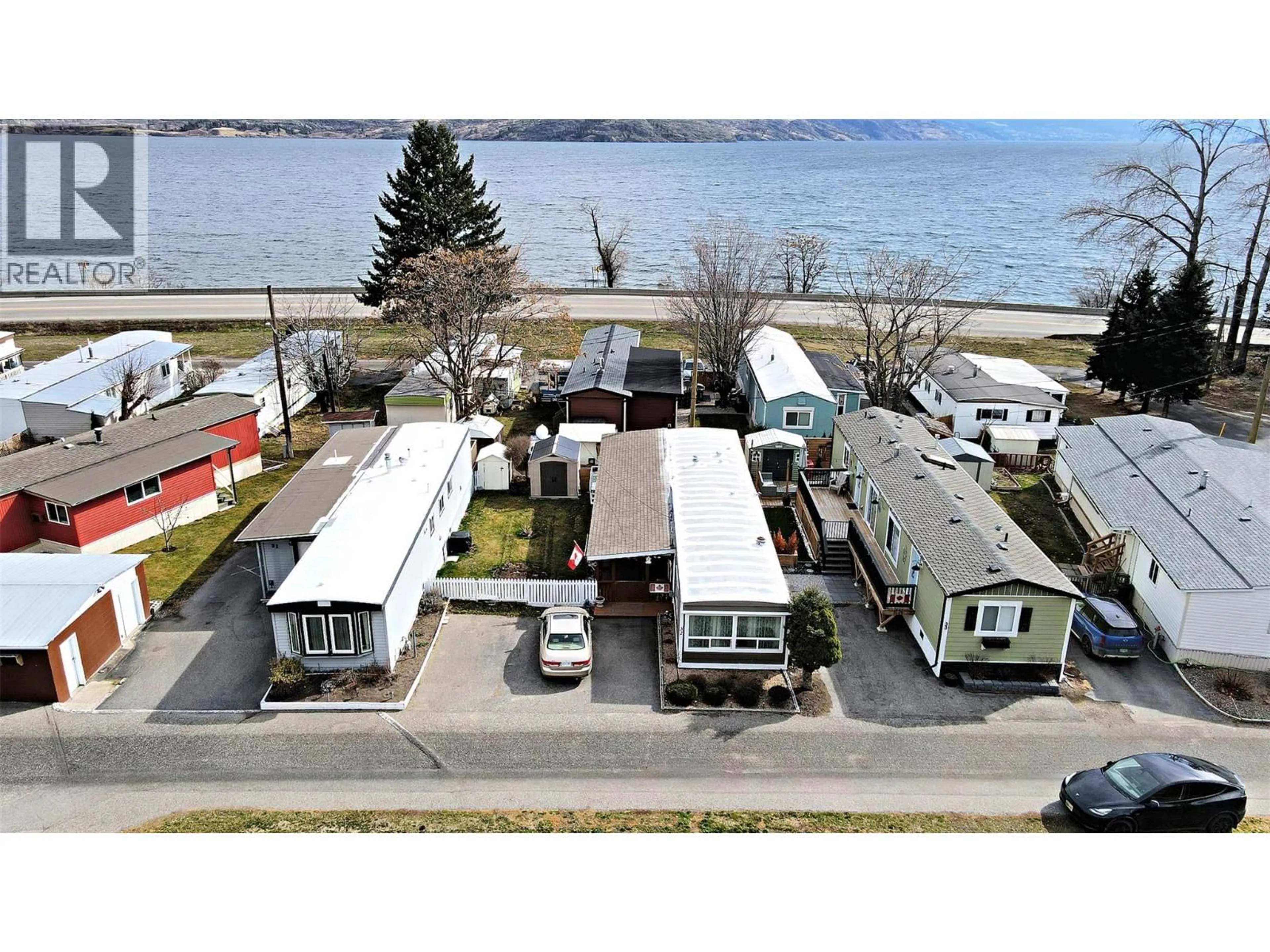 A pic from outside/outdoor area/front of a property/back of a property/a pic from drone, water/lake/river/ocean view for 32 - 6663 HWY 97 OTHER SOUTH, Peachland British Columbia V0H1X7