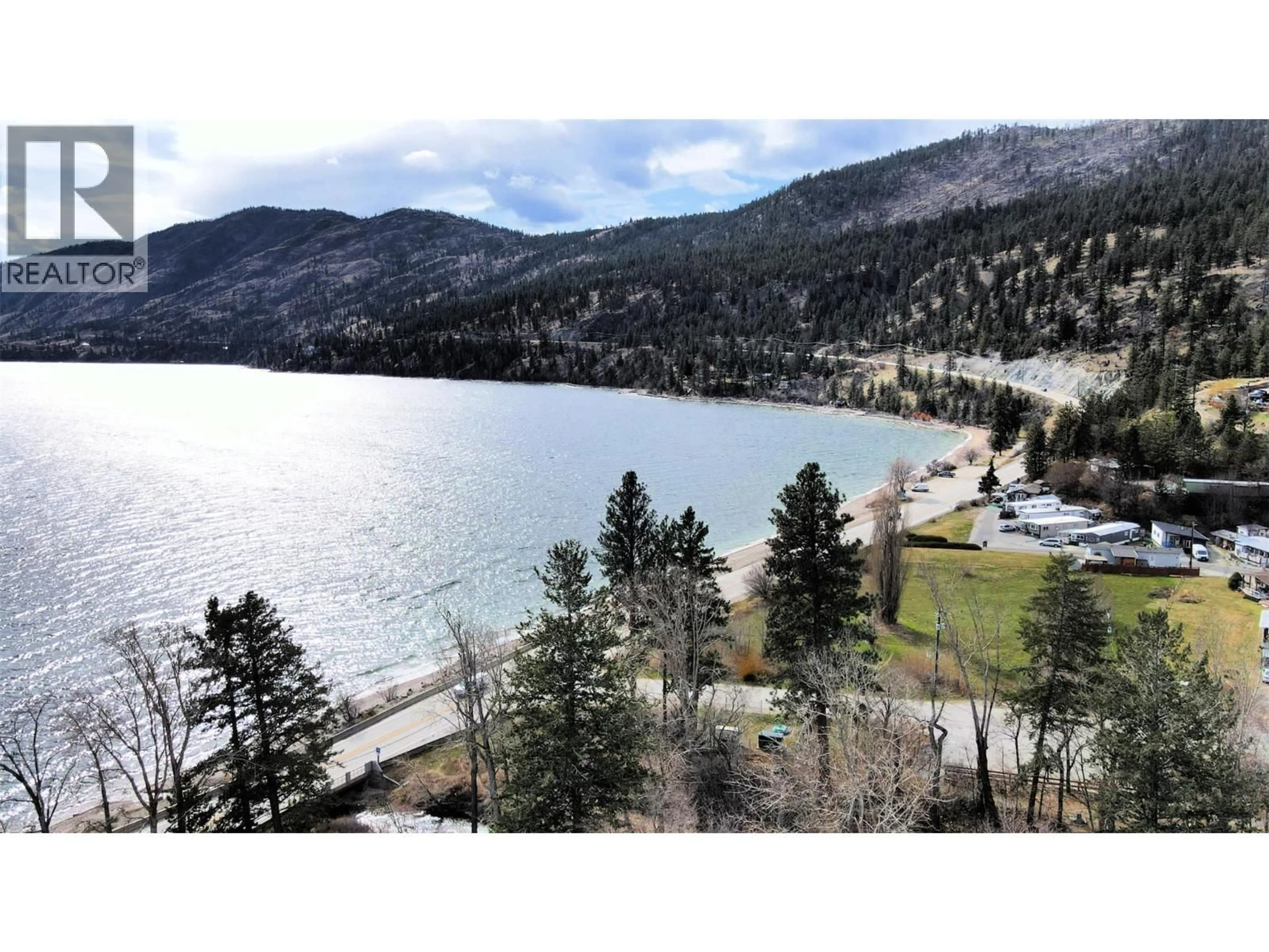 A pic from outside/outdoor area/front of a property/back of a property/a pic from drone, water/lake/river/ocean view for 32 - 6663 HWY 97 OTHER SOUTH, Peachland British Columbia V0H1X7