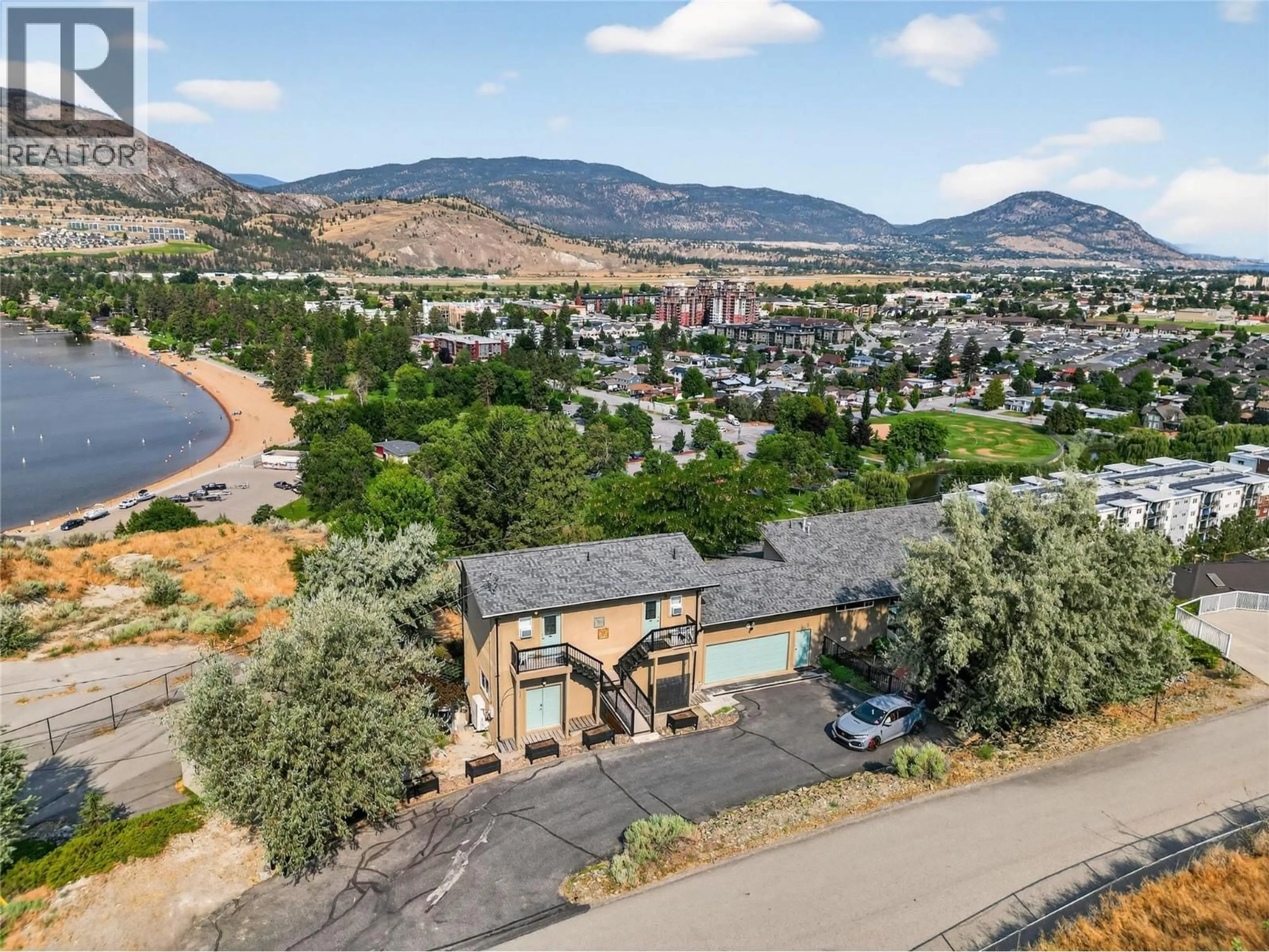 A pic from outside/outdoor area/front of a property/back of a property/a pic from drone, mountain view for 102 SPRUCE PLACE, Penticton British Columbia V2A8V9