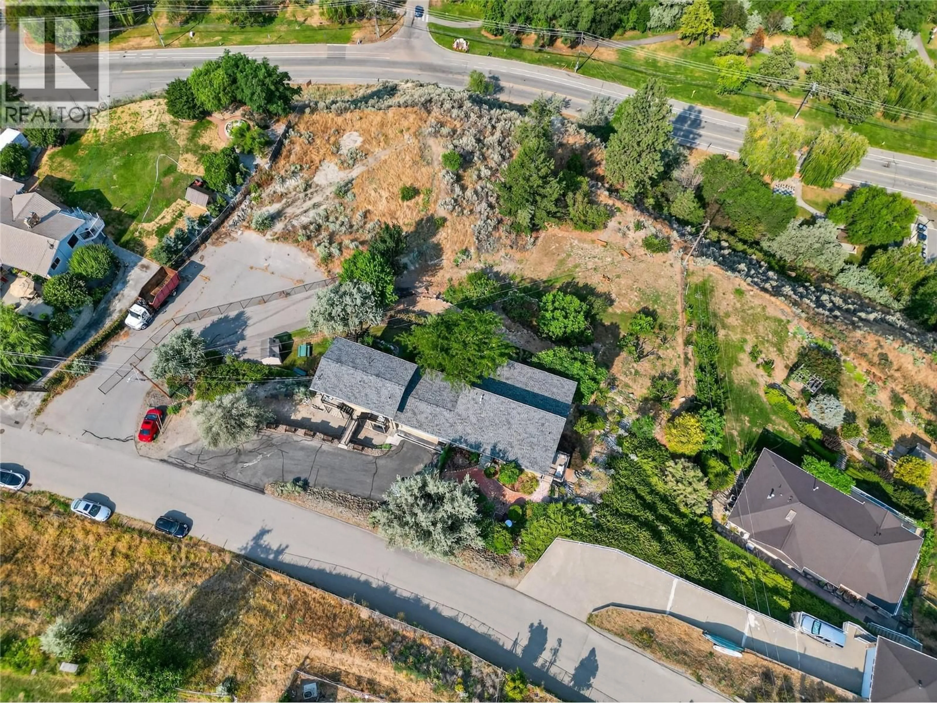 A pic from outside/outdoor area/front of a property/back of a property/a pic from drone, street for 102 SPRUCE PLACE, Penticton British Columbia V2A8V9