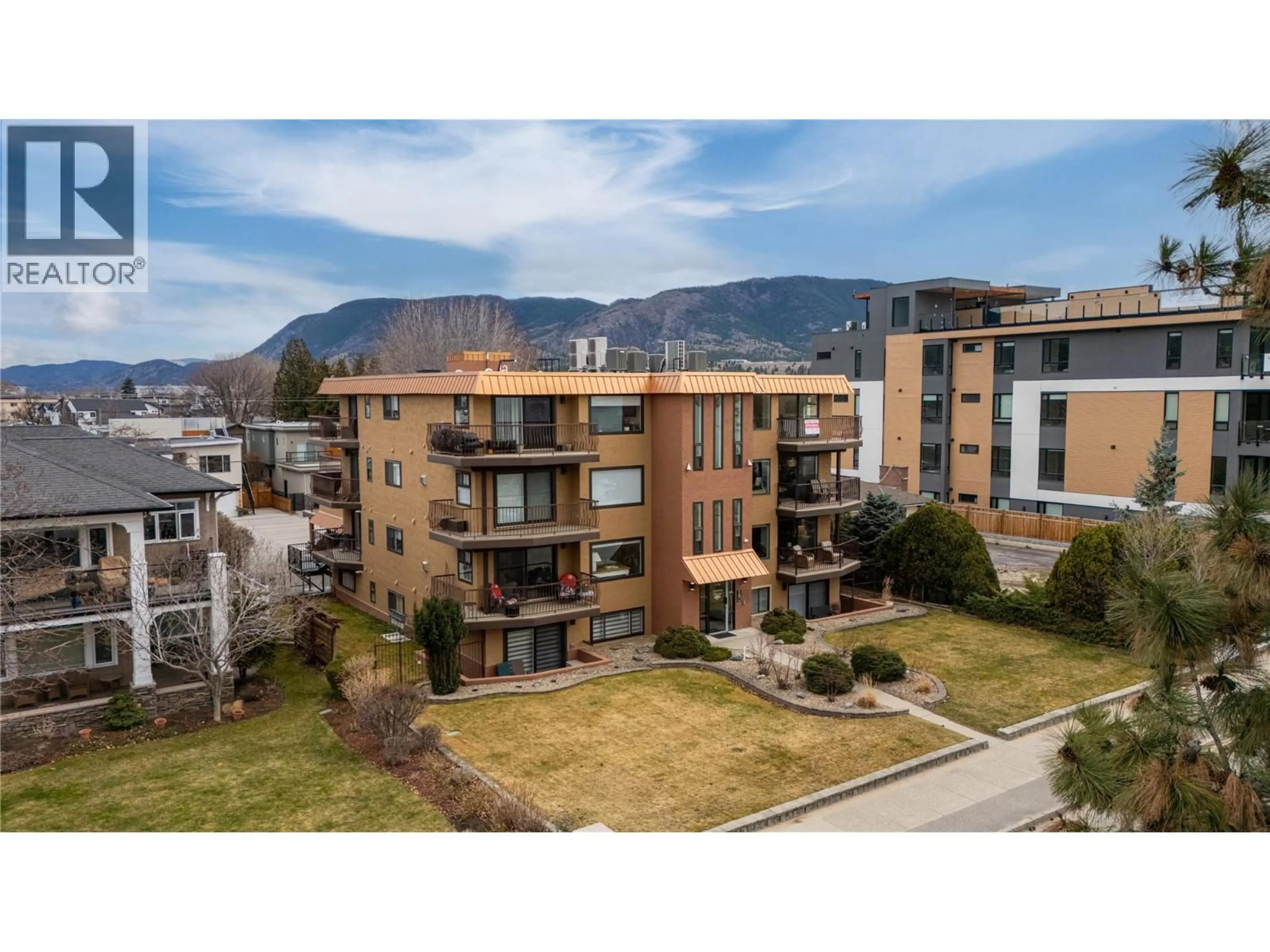A pic from outside/outdoor area/front of a property/back of a property/a pic from drone, mountain view for 203 - 578 LAKESHORE DRIVE, Penticton British Columbia V2A1B9