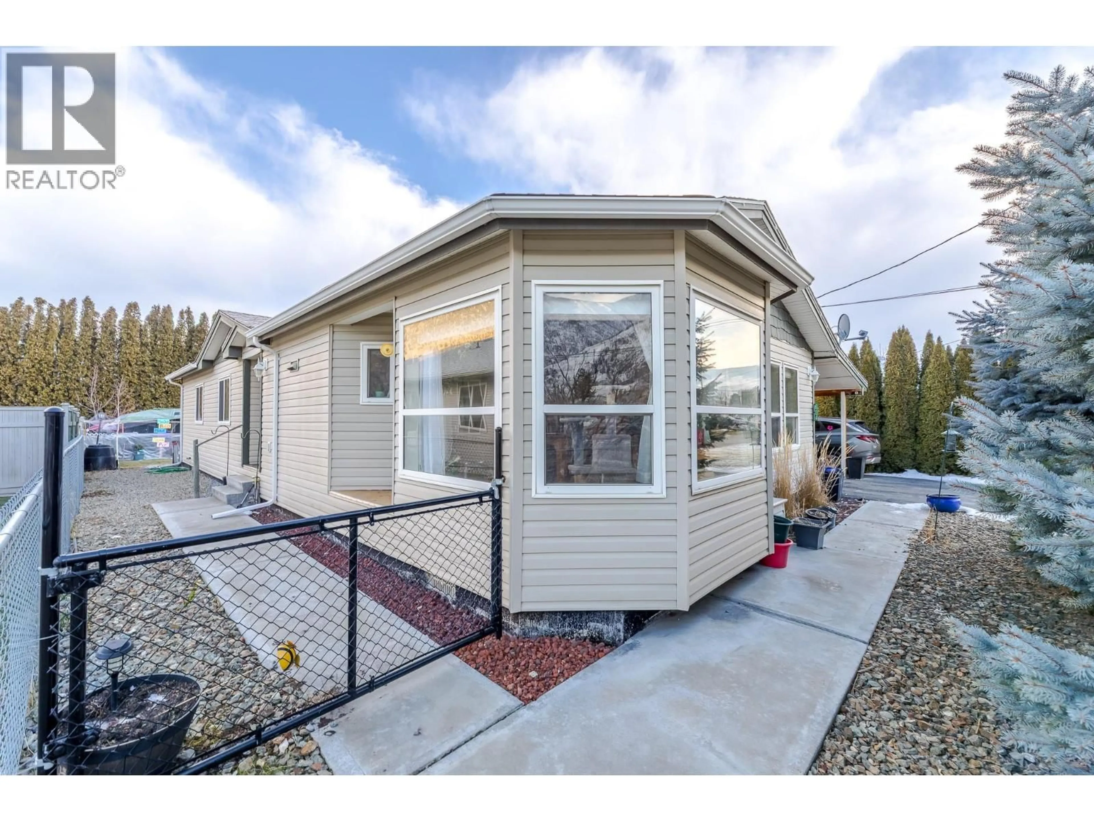 Home with vinyl exterior material, street for 604 10TH AVENUE, Keremeos British Columbia V0X1N3
