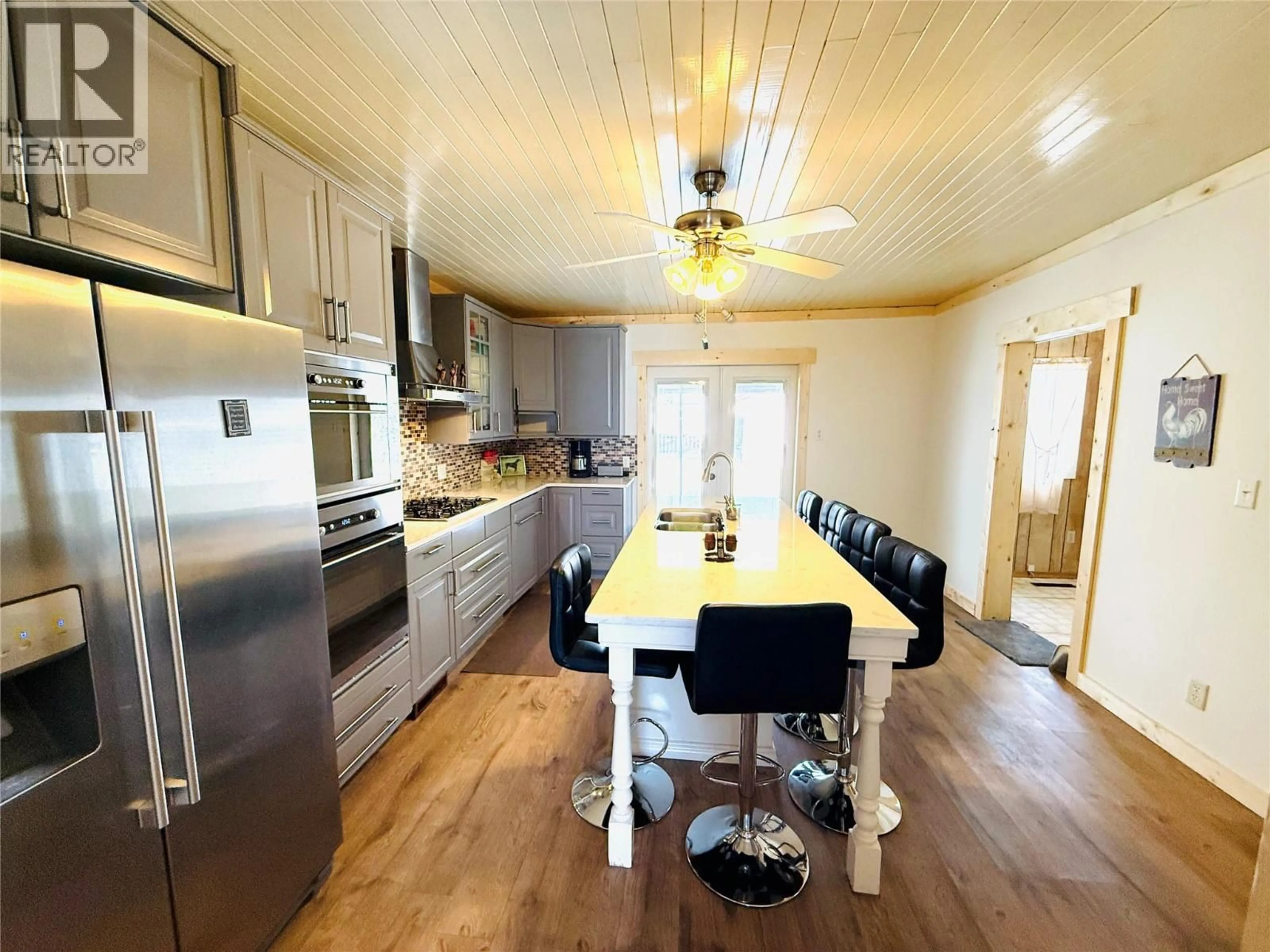 Open concept kitchen, wood/laminate floor for 4955 LUCK AVENUE, Canal Flats British Columbia V0B1B0