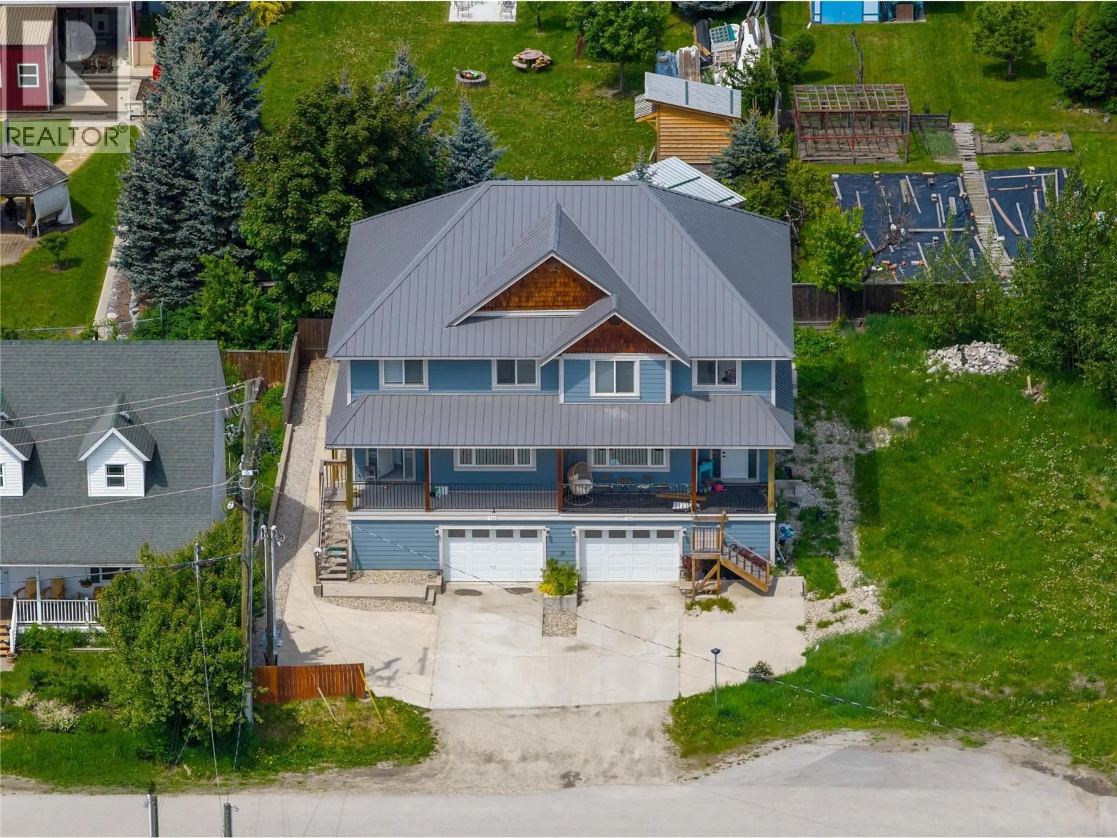 A pic from outside/outdoor area/front of a property/back of a property/a pic from drone, unknown for 705 CENTER STREET, Revelstoke British Columbia V0E2S0