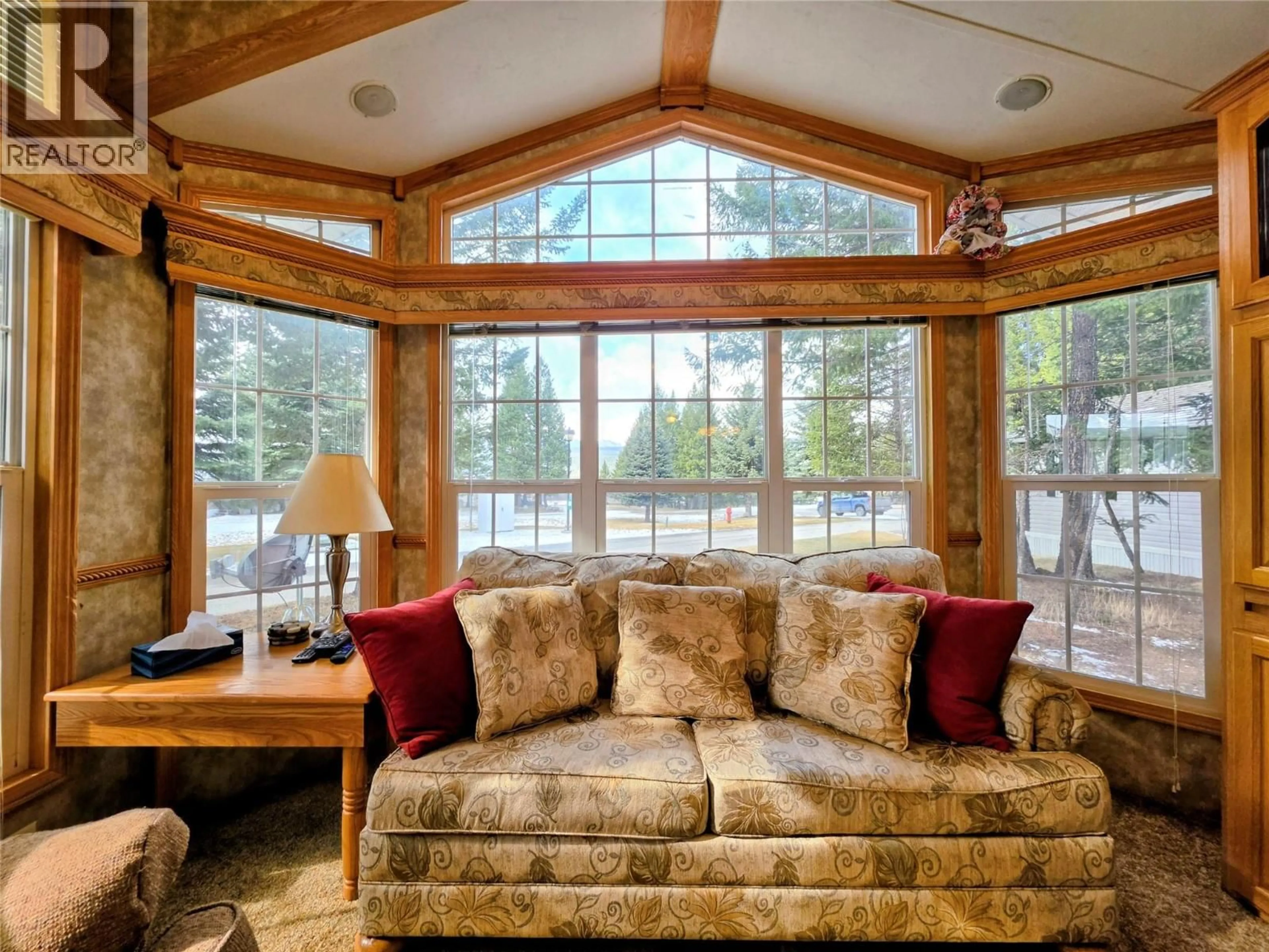 Living room with furniture, wood/laminate floor for 4586 LYNX DRIVE, Radium Hot Springs British Columbia V0A1M0