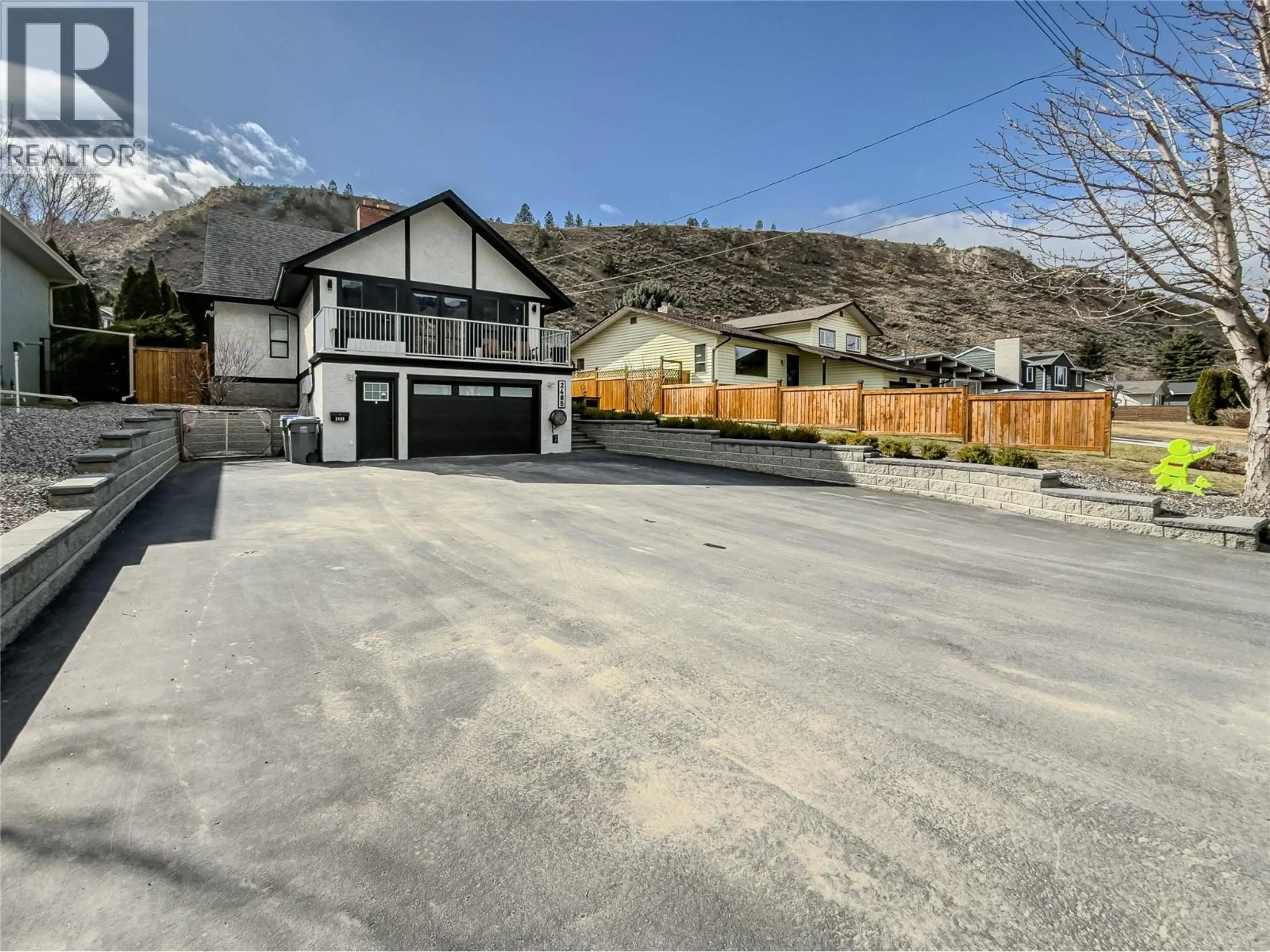 A pic from outside/outdoor area/front of a property/back of a property/a pic from drone, mountain view for 2485 VALLEYVIEW DRIVE, Kamloops British Columbia V2C4E2