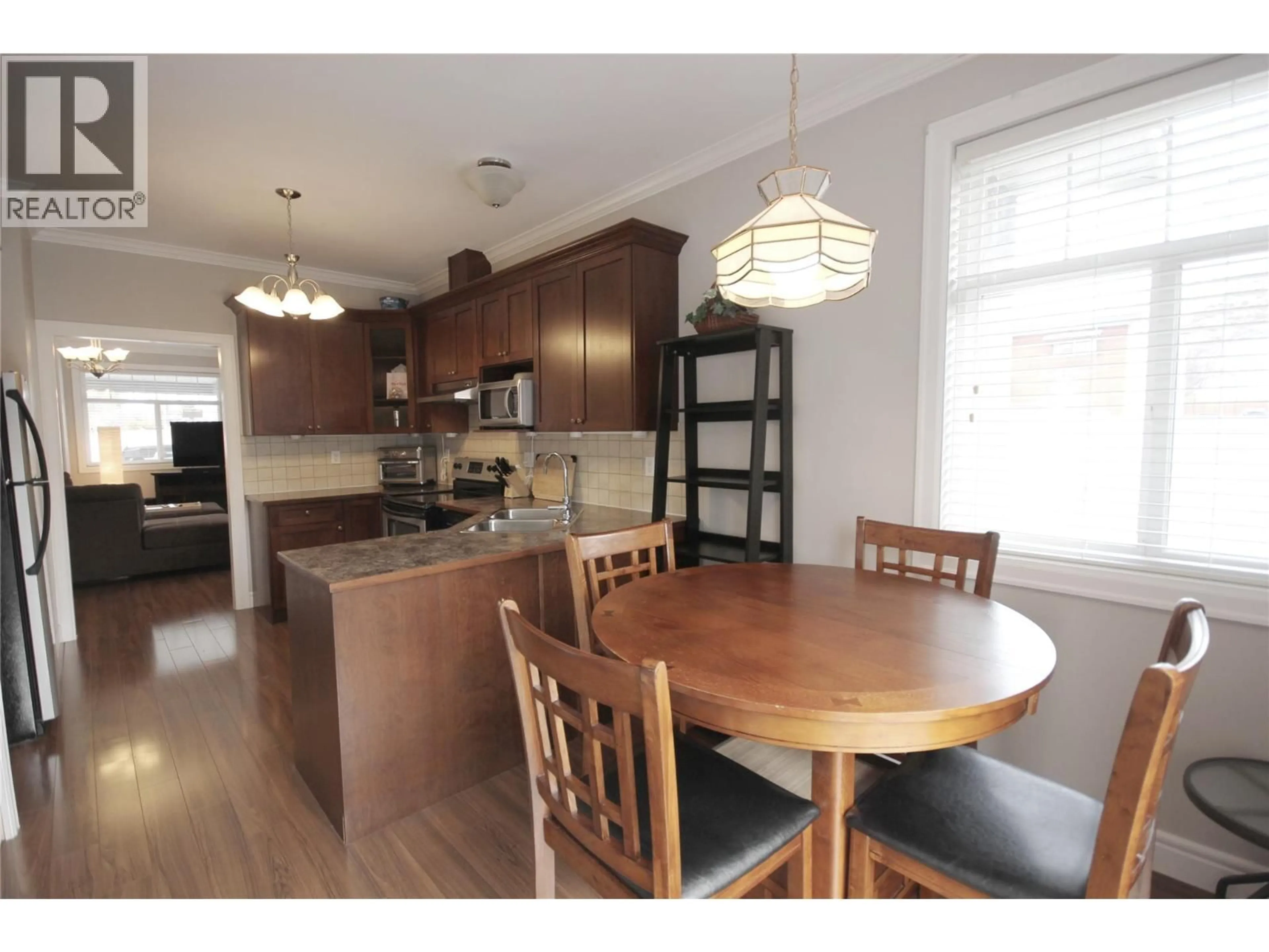 Open concept kitchen, wood/laminate floor for 101 - 3011 SOUTH MAIN STREET, Penticton British Columbia V2A5J7