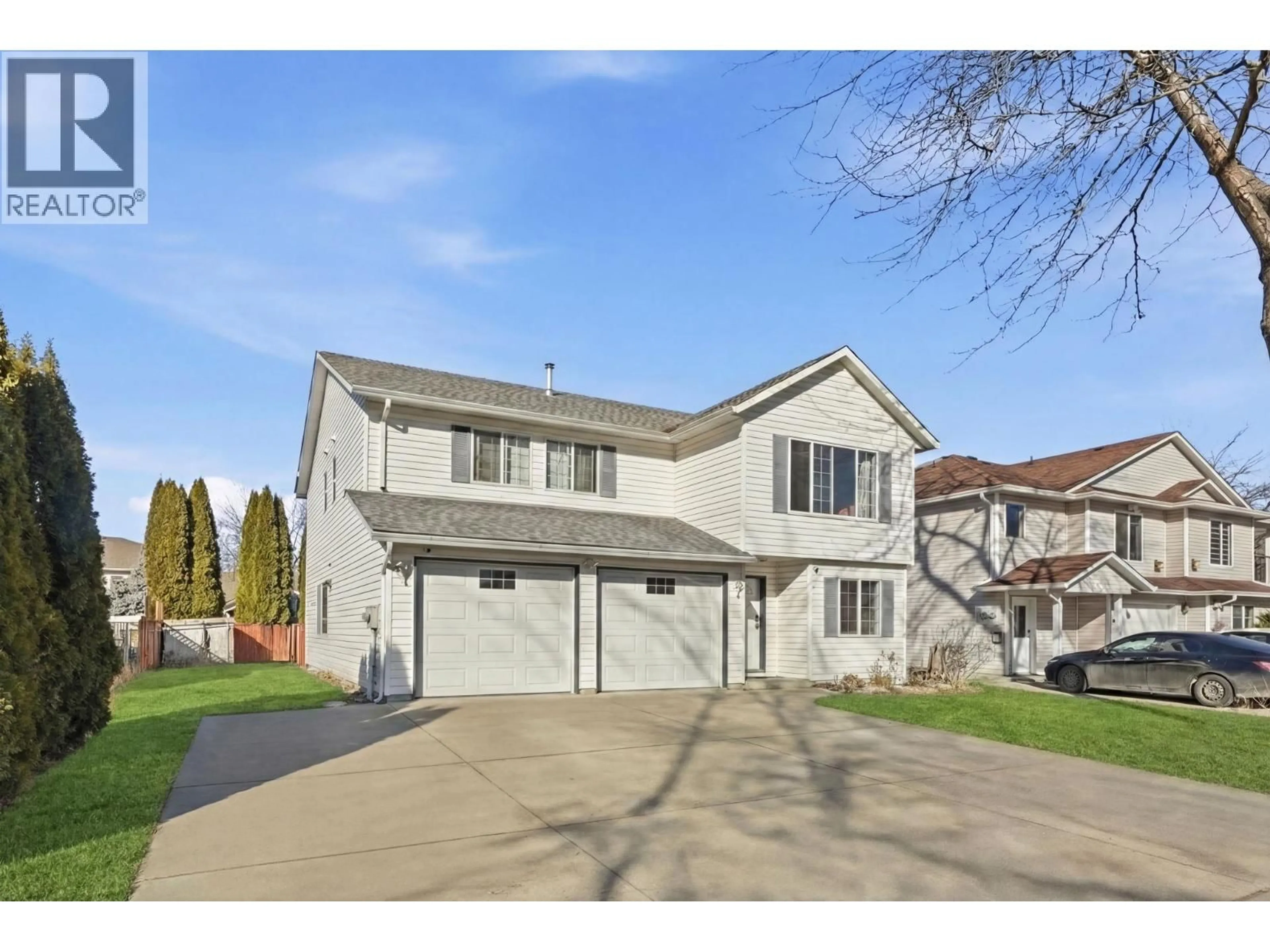 Home with vinyl exterior material, street for MCLENNAN CRESCENT, Kelowna British Columbia V1X7M9