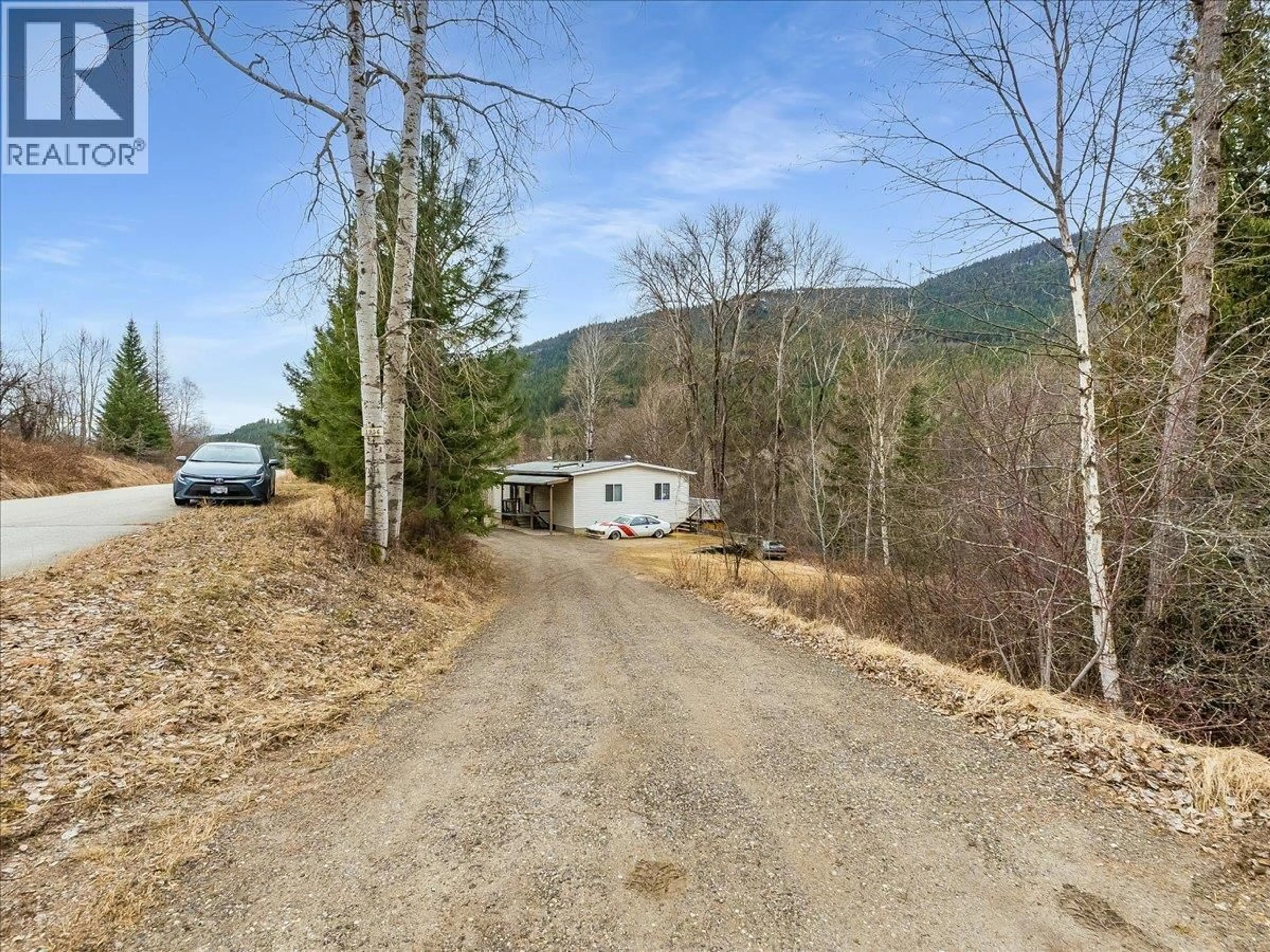 A pic from outside/outdoor area/front of a property/back of a property/a pic from drone, mountain view for 1956 SOUKOROFF ROAD, Pass Creek British Columbia V1N4S9