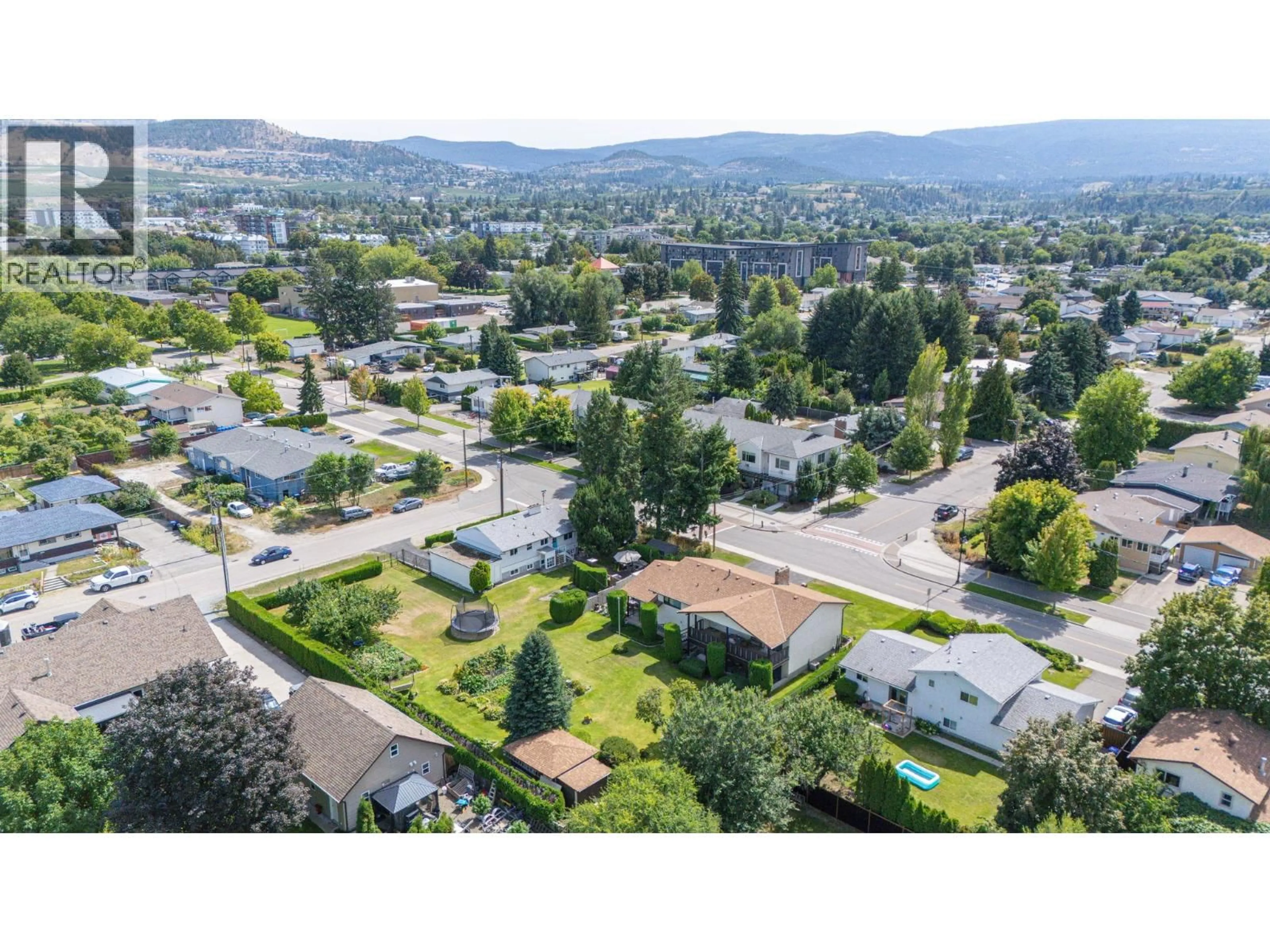 A pic from outside/outdoor area/front of a property/back of a property/a pic from drone, mountain view for 350 FLEMING ROAD, Kelowna British Columbia V1X3Z3