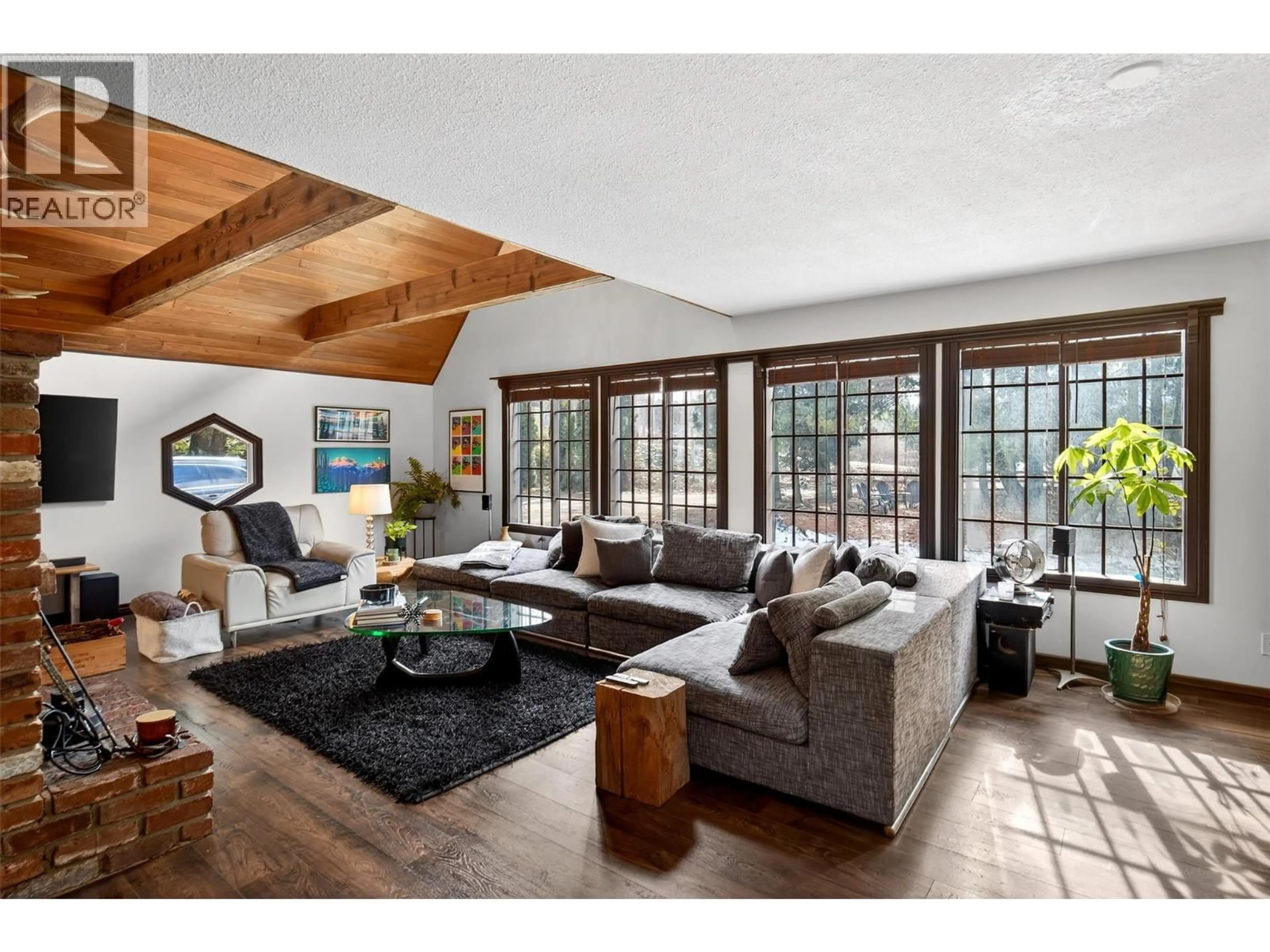 Living room with furniture, wood/laminate floor for 3025 CAMOZZI ROAD, Revelstoke British Columbia V0E2S3