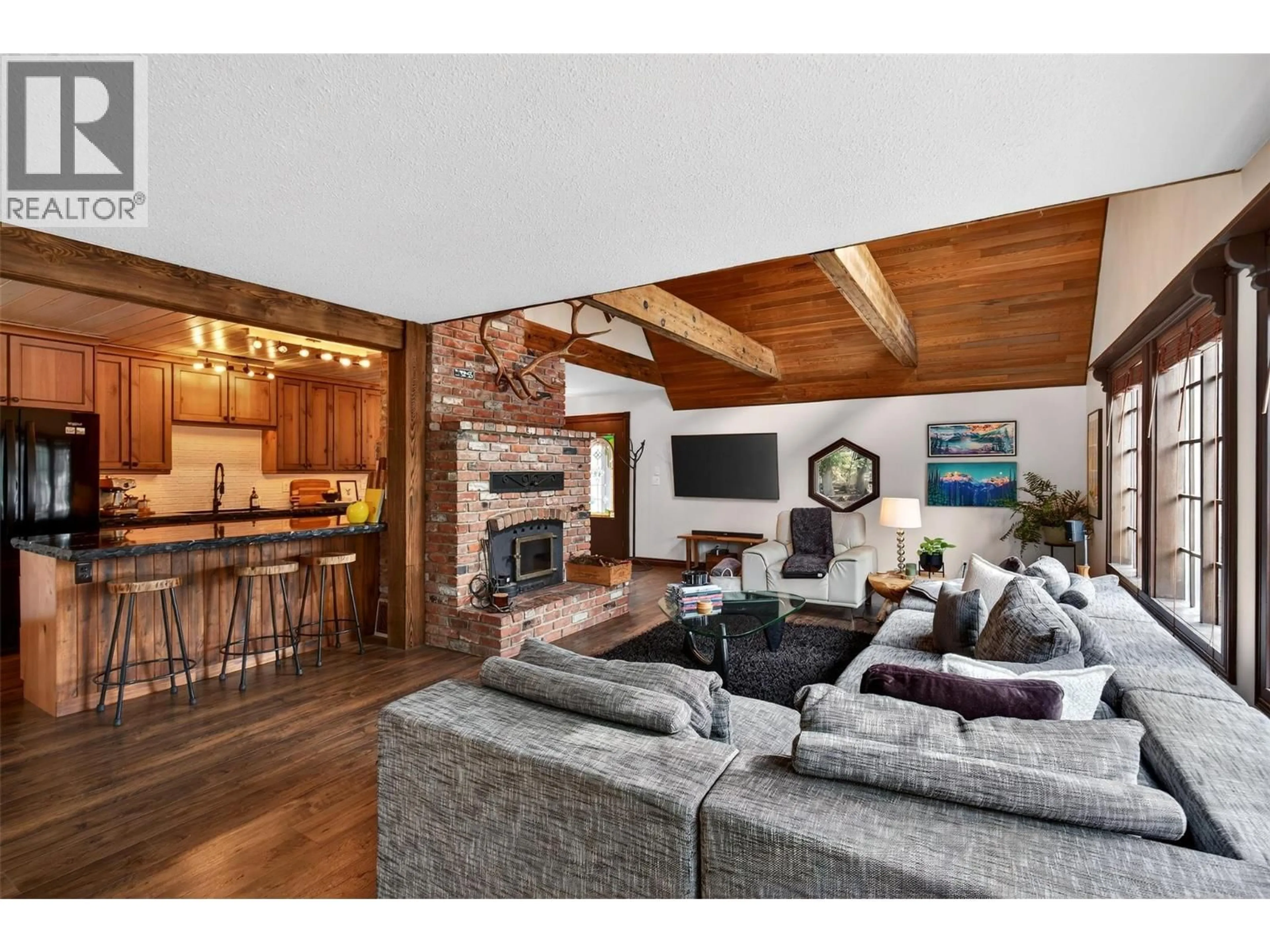 Living room with furniture, wood/laminate floor for 3025 CAMOZZI ROAD, Revelstoke British Columbia V0E2S3