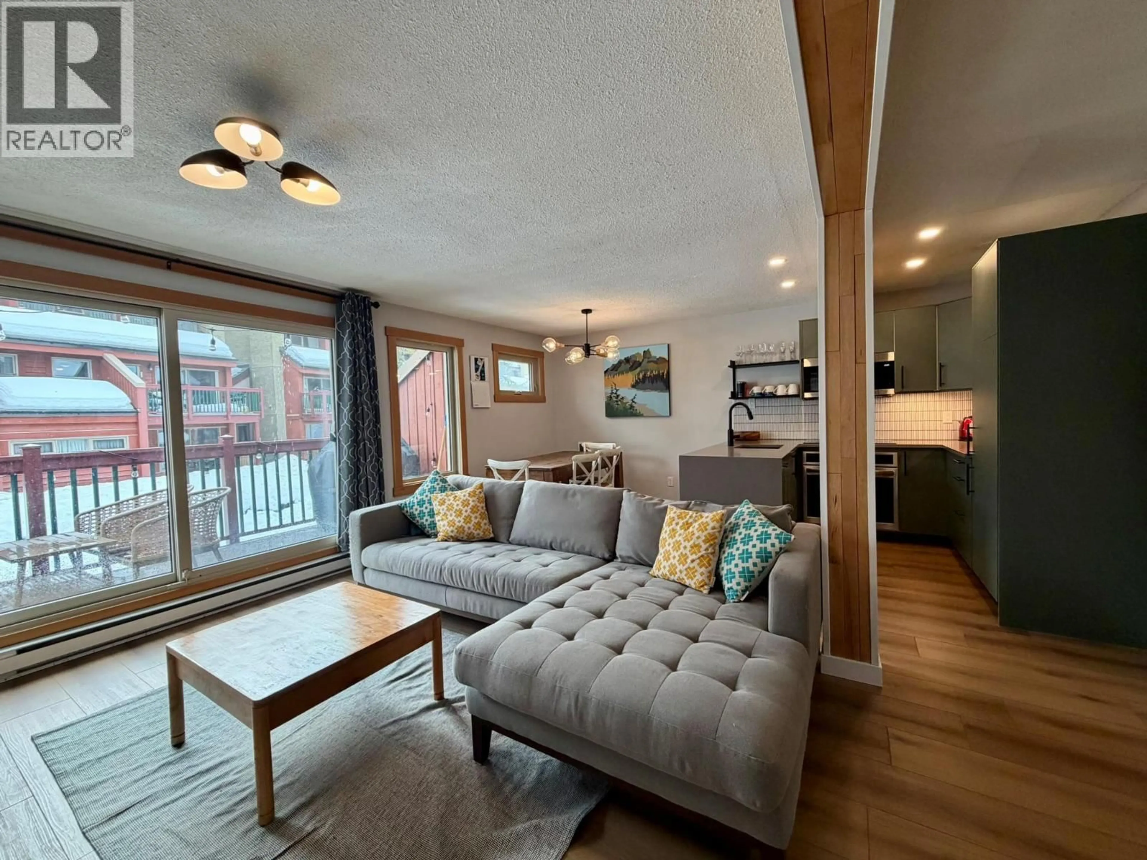 Living room with furniture, wood/laminate floor for 317 - 2030 PANORAMA DRIVE, Panorama British Columbia V0A1T0