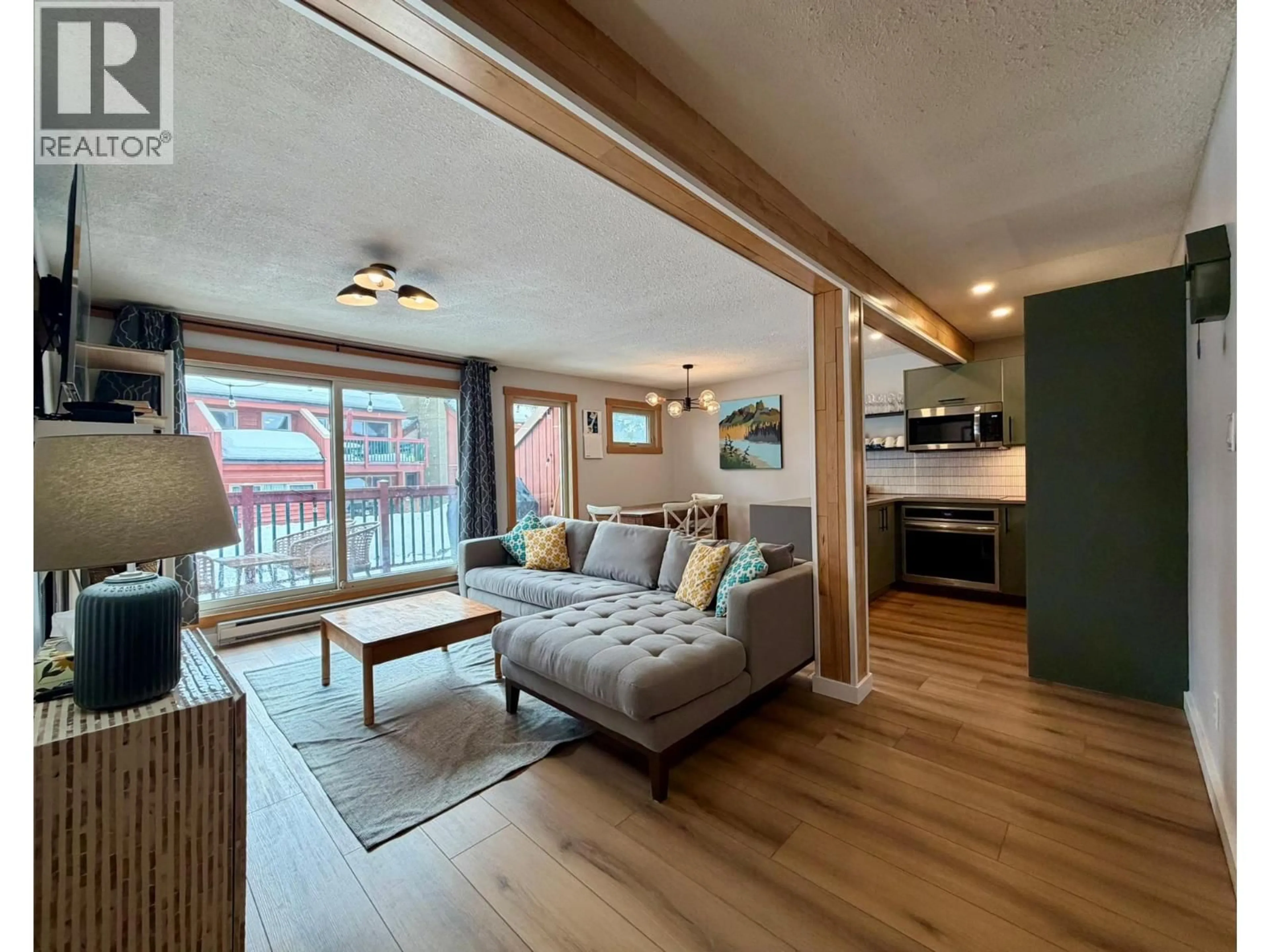 Living room with furniture, wood/laminate floor for 317 - 2030 PANORAMA DRIVE, Panorama British Columbia V0A1T0