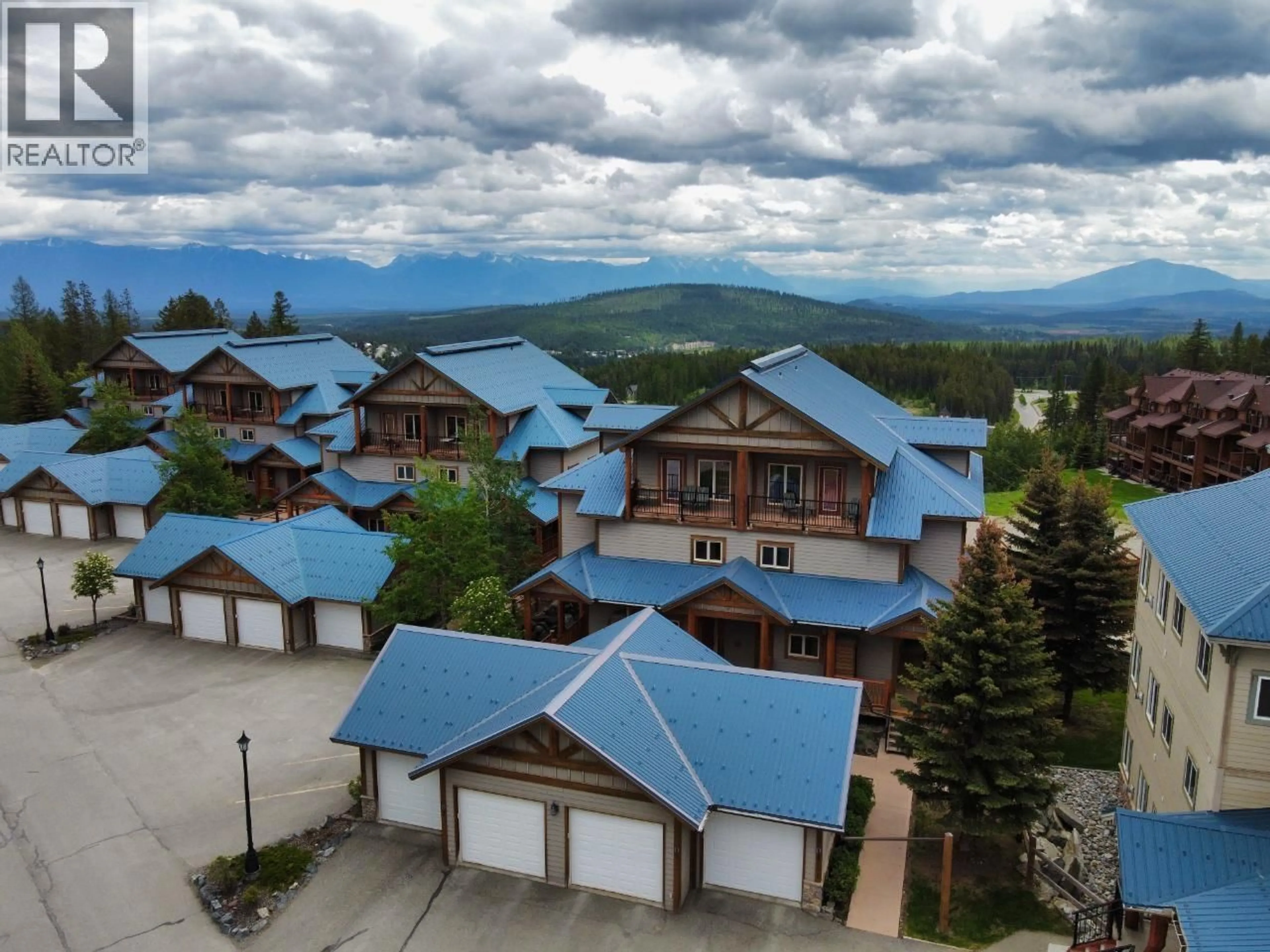 A pic from outside/outdoor area/front of a property/back of a property/a pic from drone, mountain view for D2-B - 1351 GERRY SORENSEN WAY, Kimberley British Columbia V1A2Y4