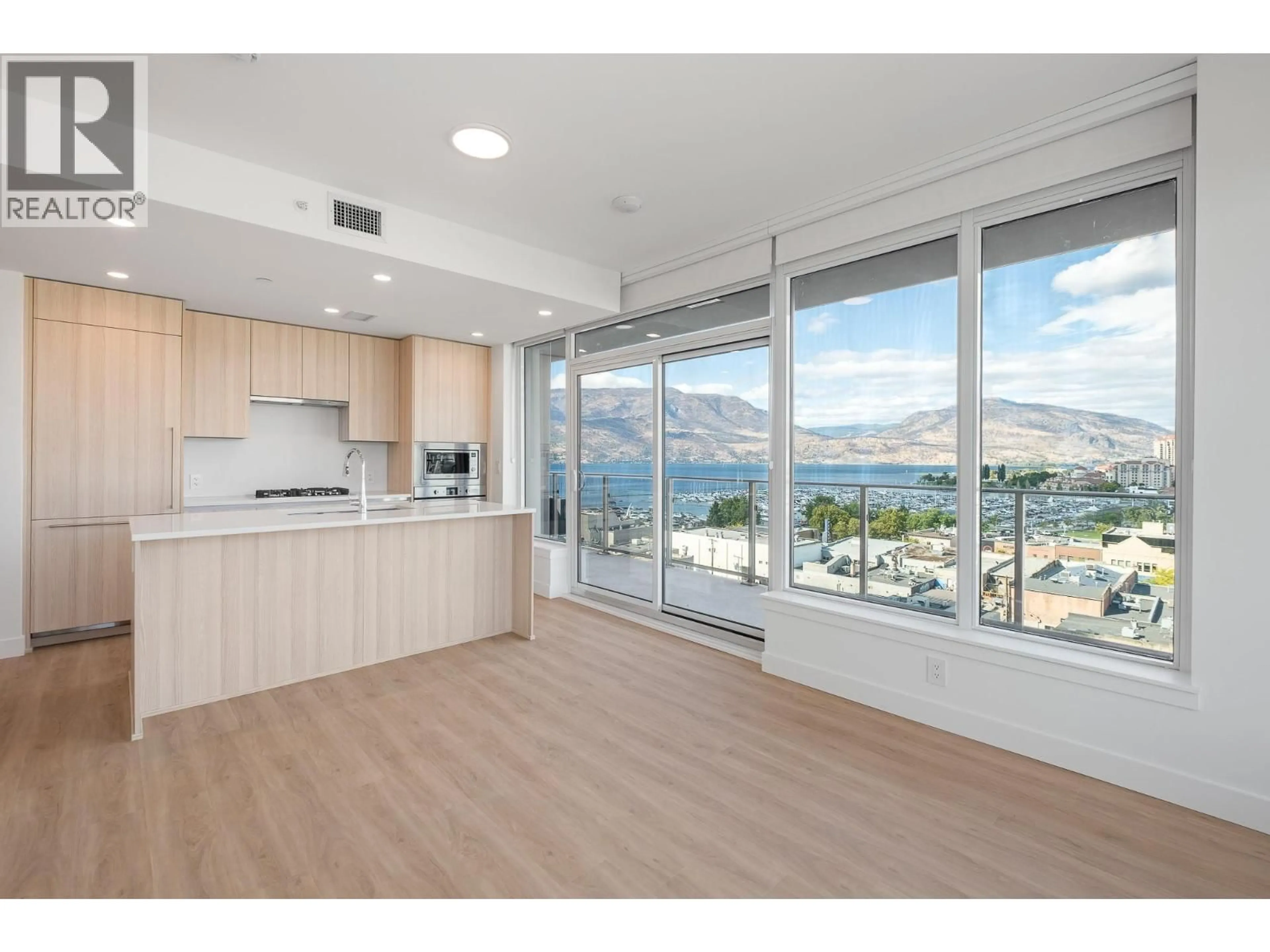 Open concept kitchen, wood/laminate floor for 902 - 1626 WATER STREET, Kelowna British Columbia V1Y1J9