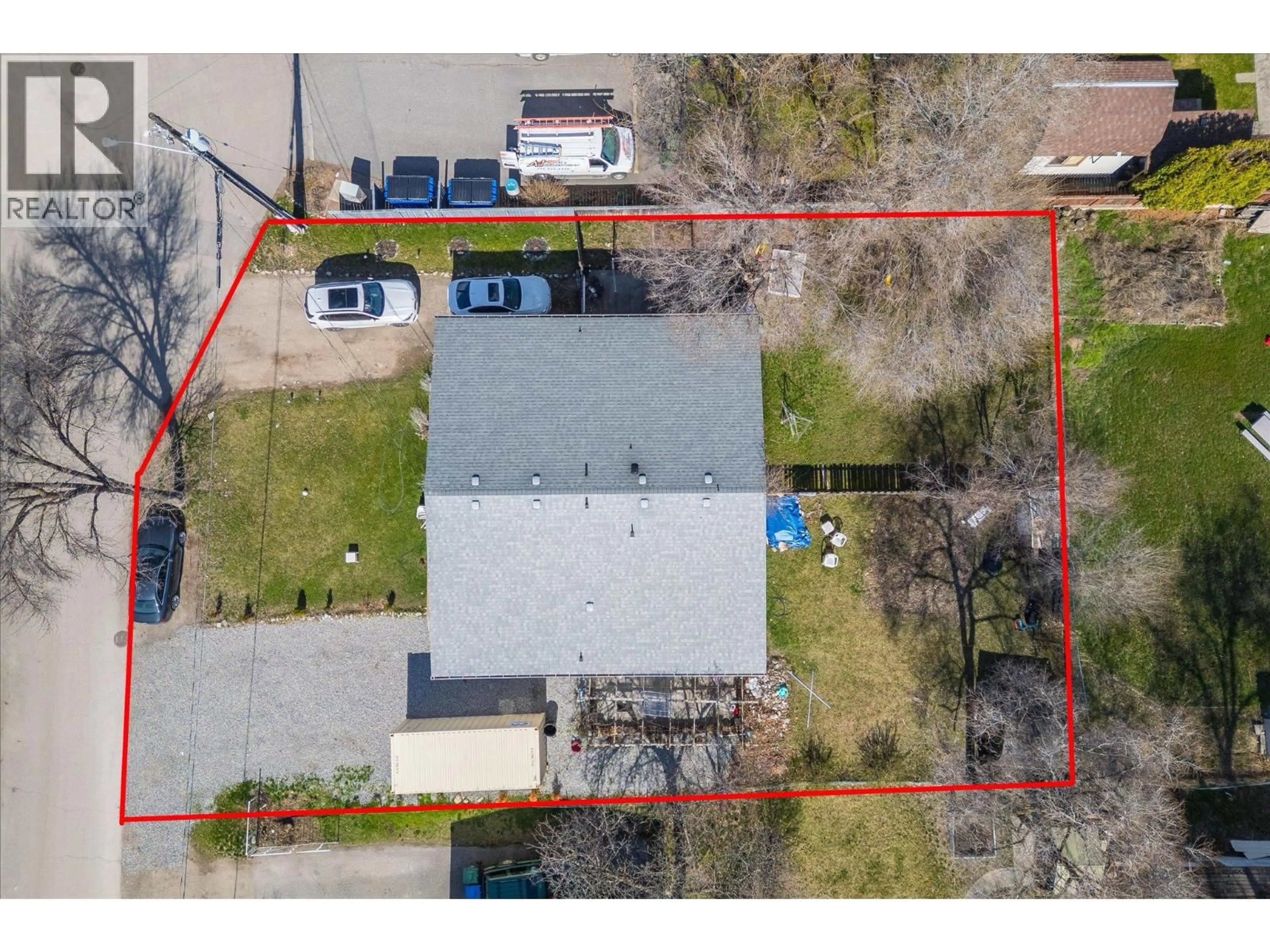 A pic from outside/outdoor area/front of a property/back of a property/a pic from drone, street for 145-147 WOODS ROAD, Kelowna British Columbia V1X4G4