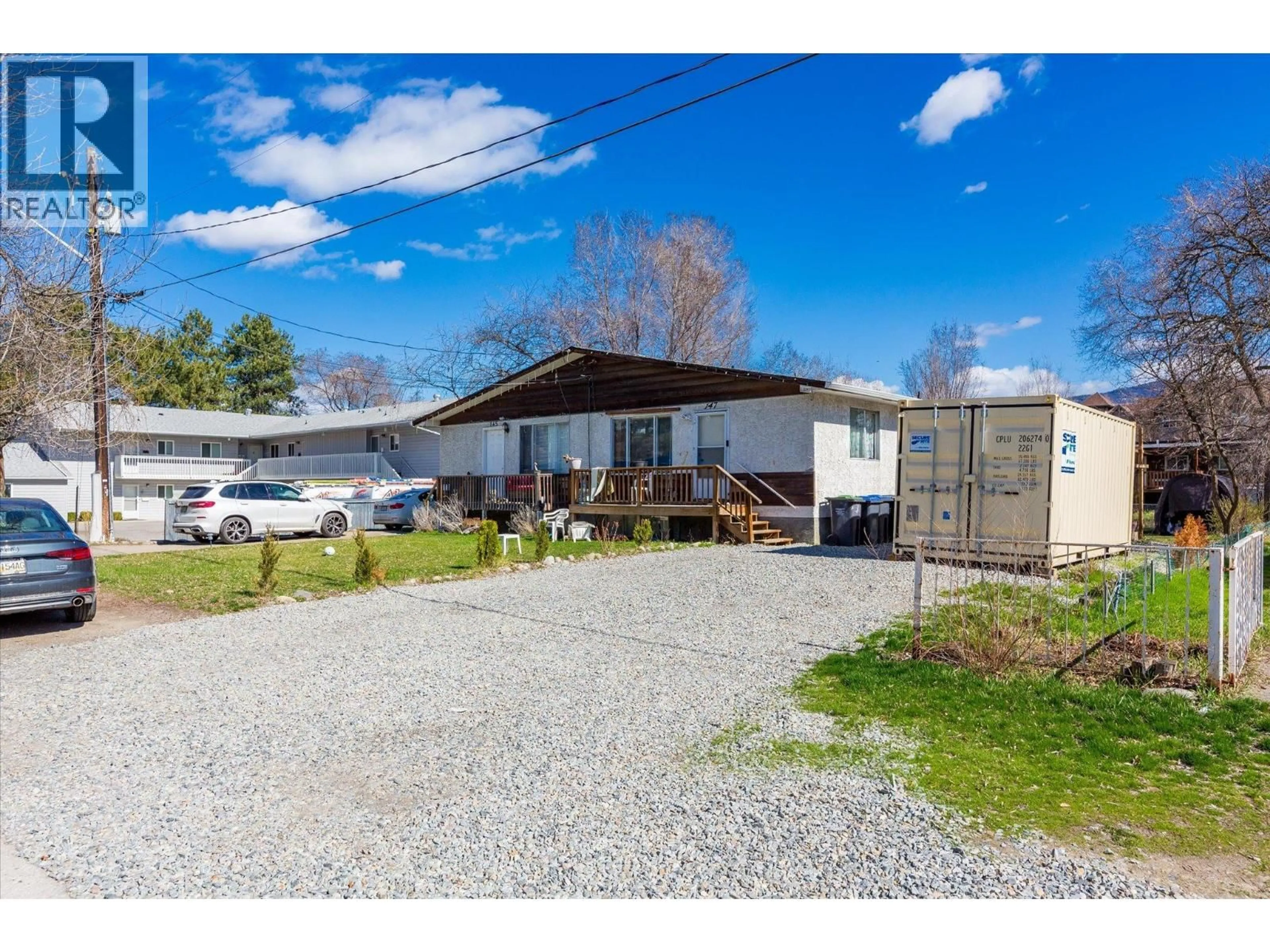 A pic from outside/outdoor area/front of a property/back of a property/a pic from drone, street for 145-147 WOODS ROAD, Kelowna British Columbia V1X4G4