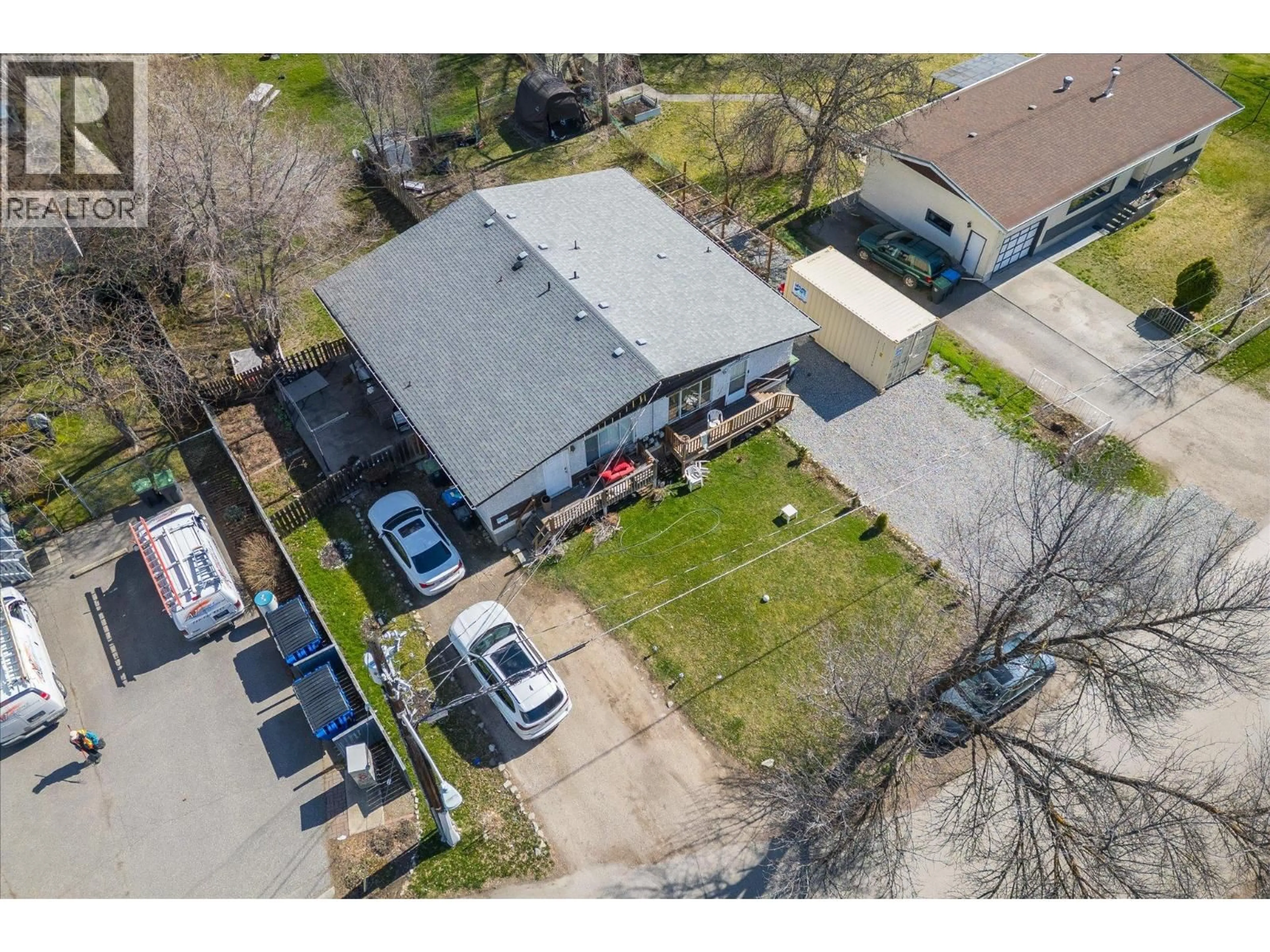 A pic from outside/outdoor area/front of a property/back of a property/a pic from drone, street for 145-147 WOODS ROAD, Kelowna British Columbia V1X4G4