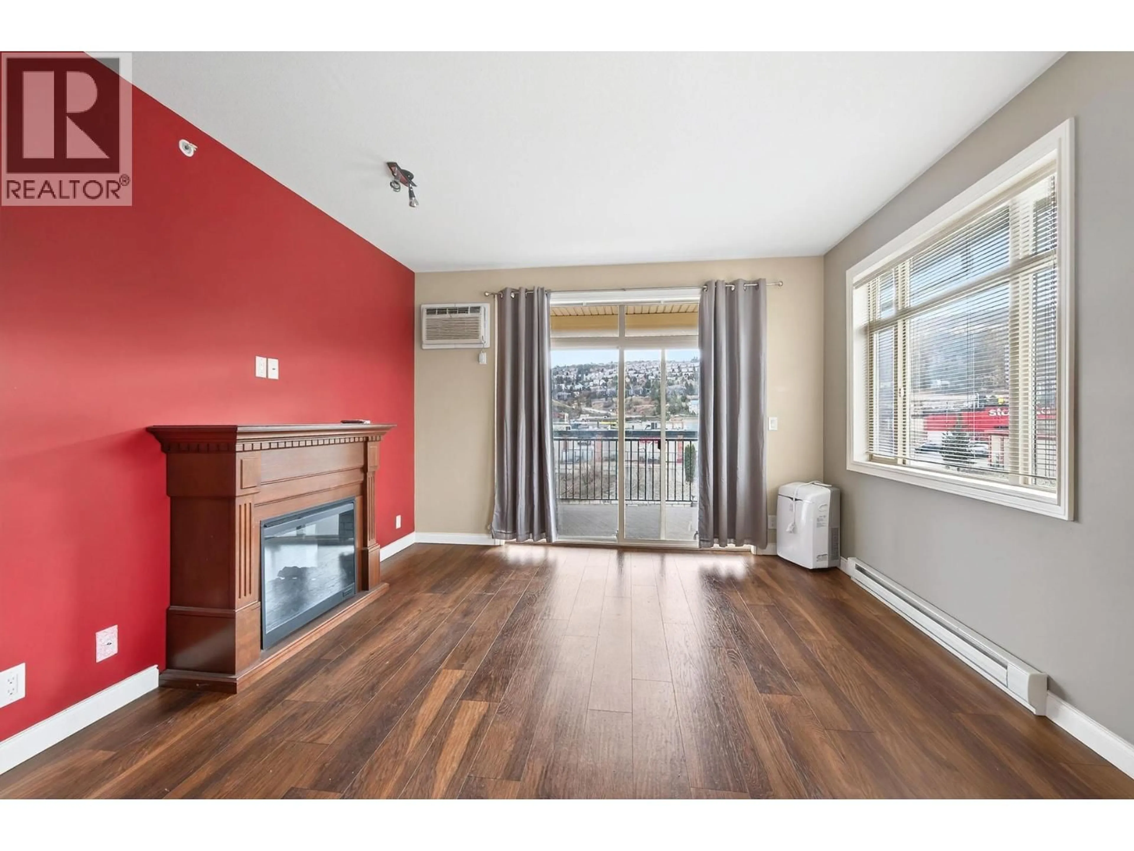 Living room with furniture, wood/laminate floor for #302 - 1390 HILLSIDE DRIVE, Kamloops British Columbia V2E0A6