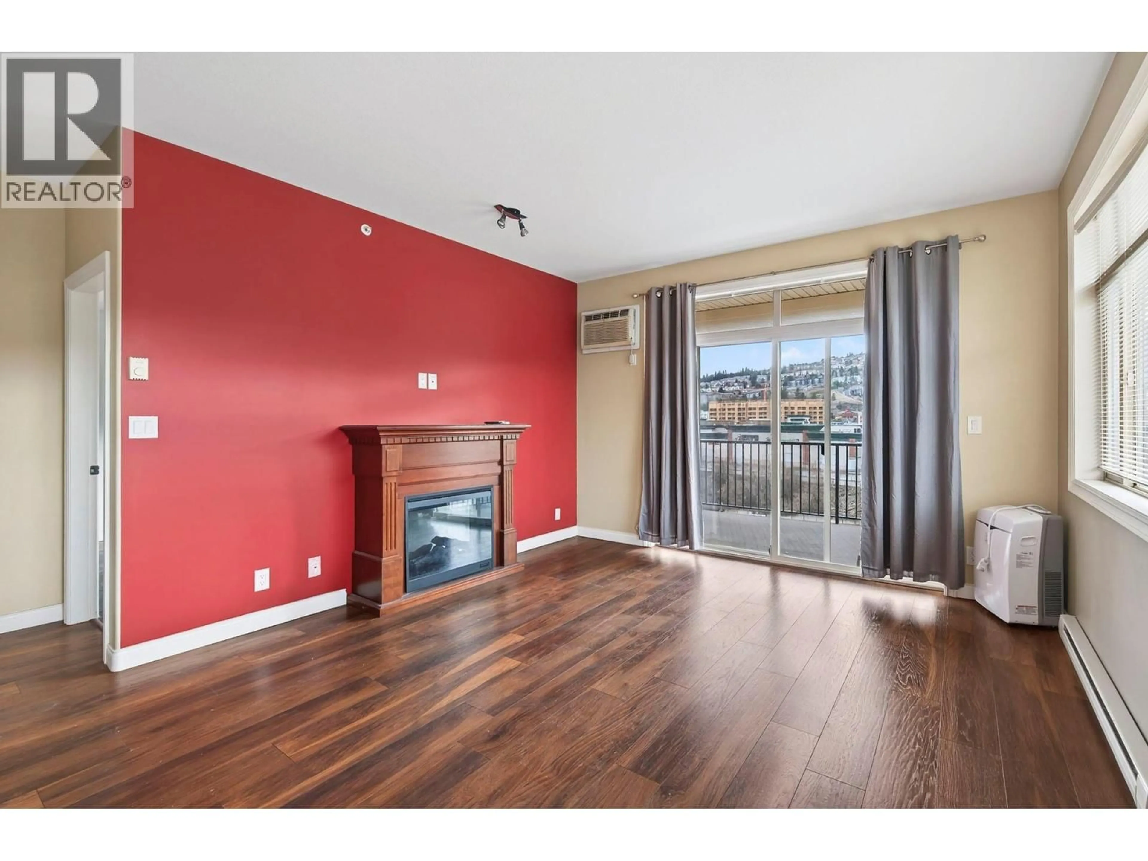 Living room with furniture, wood/laminate floor for #302 - 1390 HILLSIDE DRIVE, Kamloops British Columbia V2E0A6