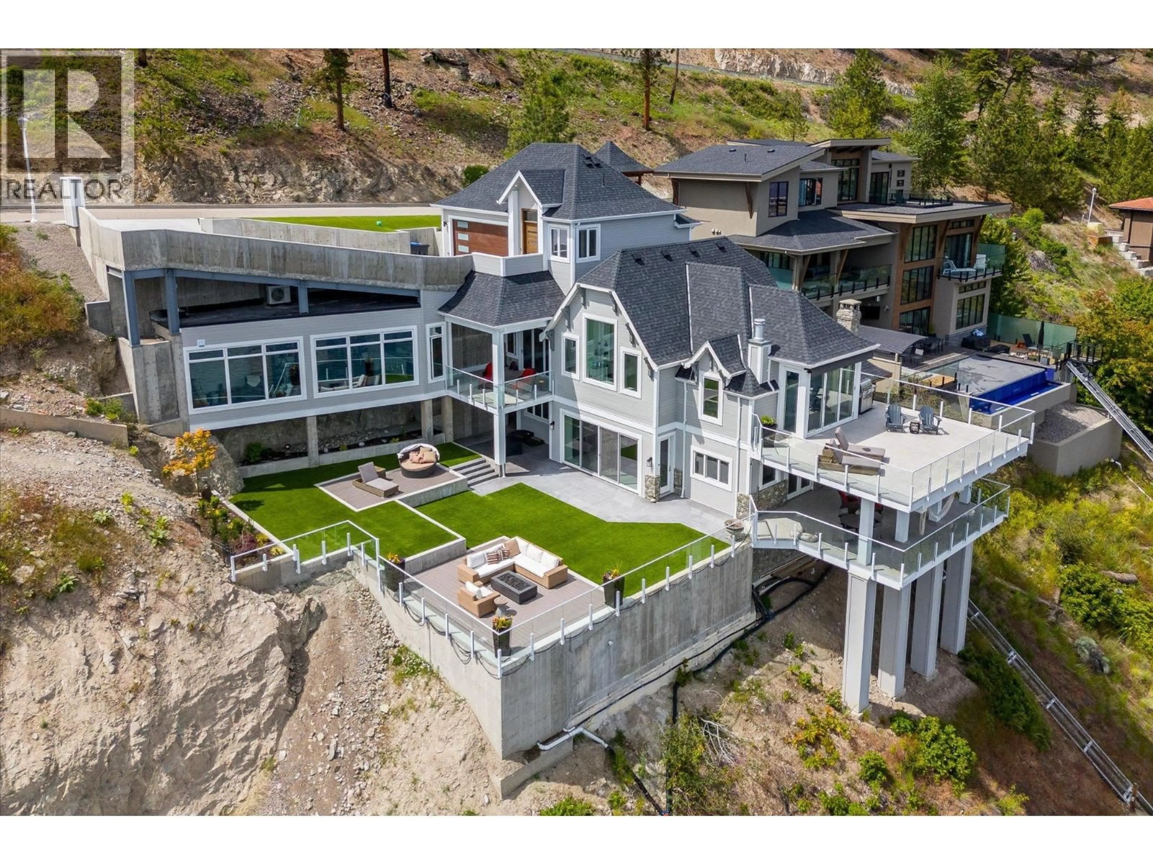 A pic from outside/outdoor area/front of a property/back of a property/a pic from drone, mountain view for 22 - 901 WESTSIDE ROAD SOUTH, West Kelowna British Columbia V1Z3W9