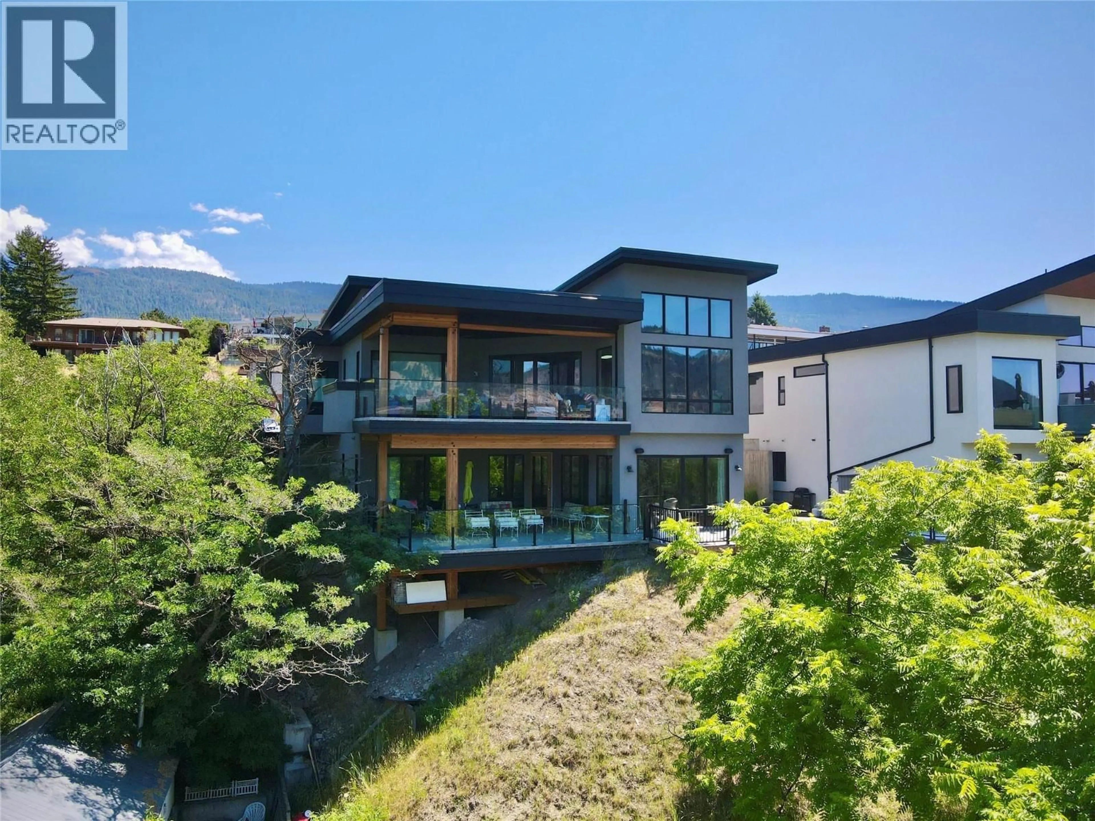 A pic from outside/outdoor area/front of a property/back of a property/a pic from drone, mountain view for 15896 CLARIDGE DRIVE, Lake Country British Columbia V4V2T6