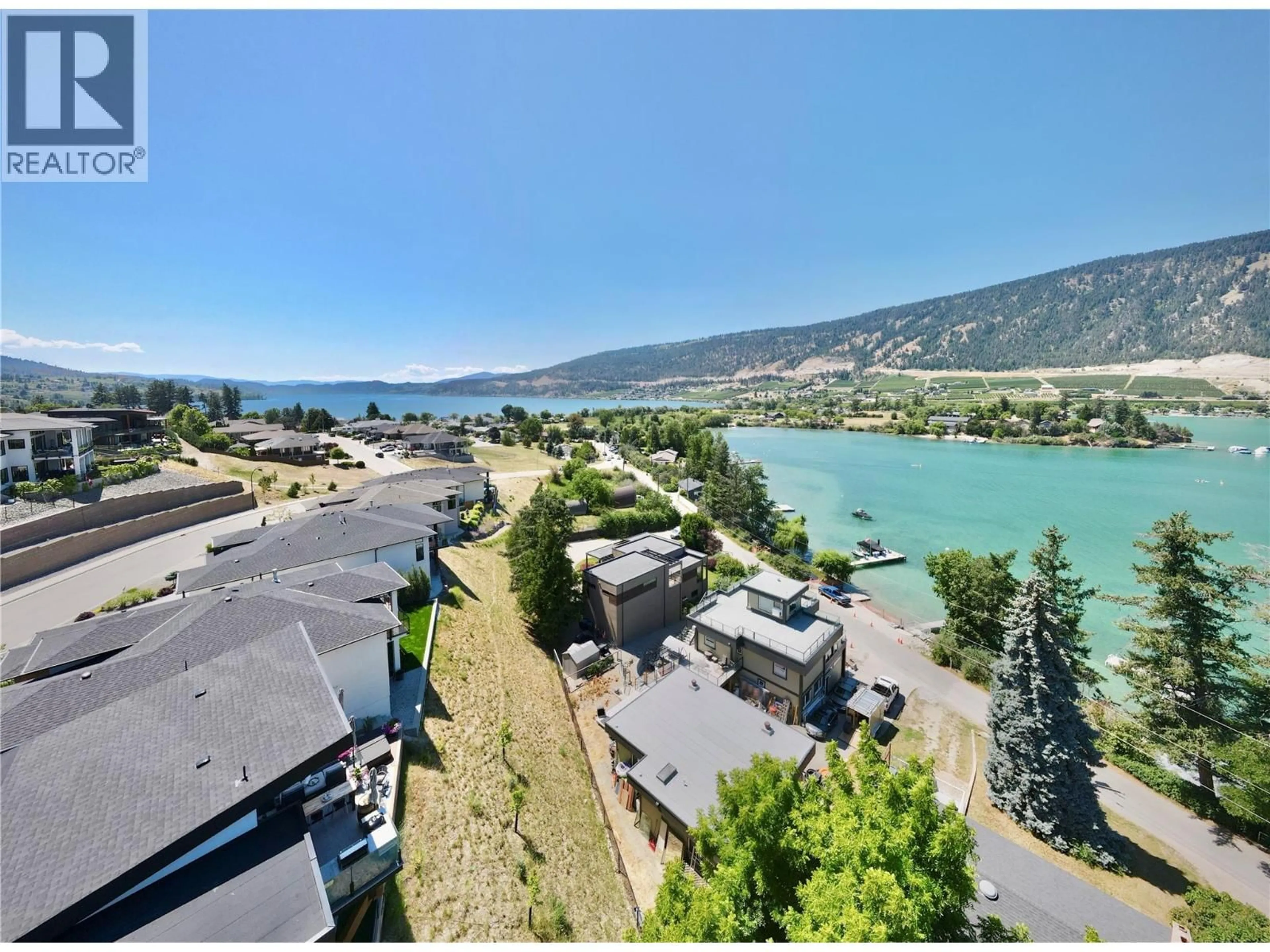 A pic from outside/outdoor area/front of a property/back of a property/a pic from drone, water/lake/river/ocean view for 15896 CLARIDGE DRIVE, Lake Country British Columbia V4V2T6