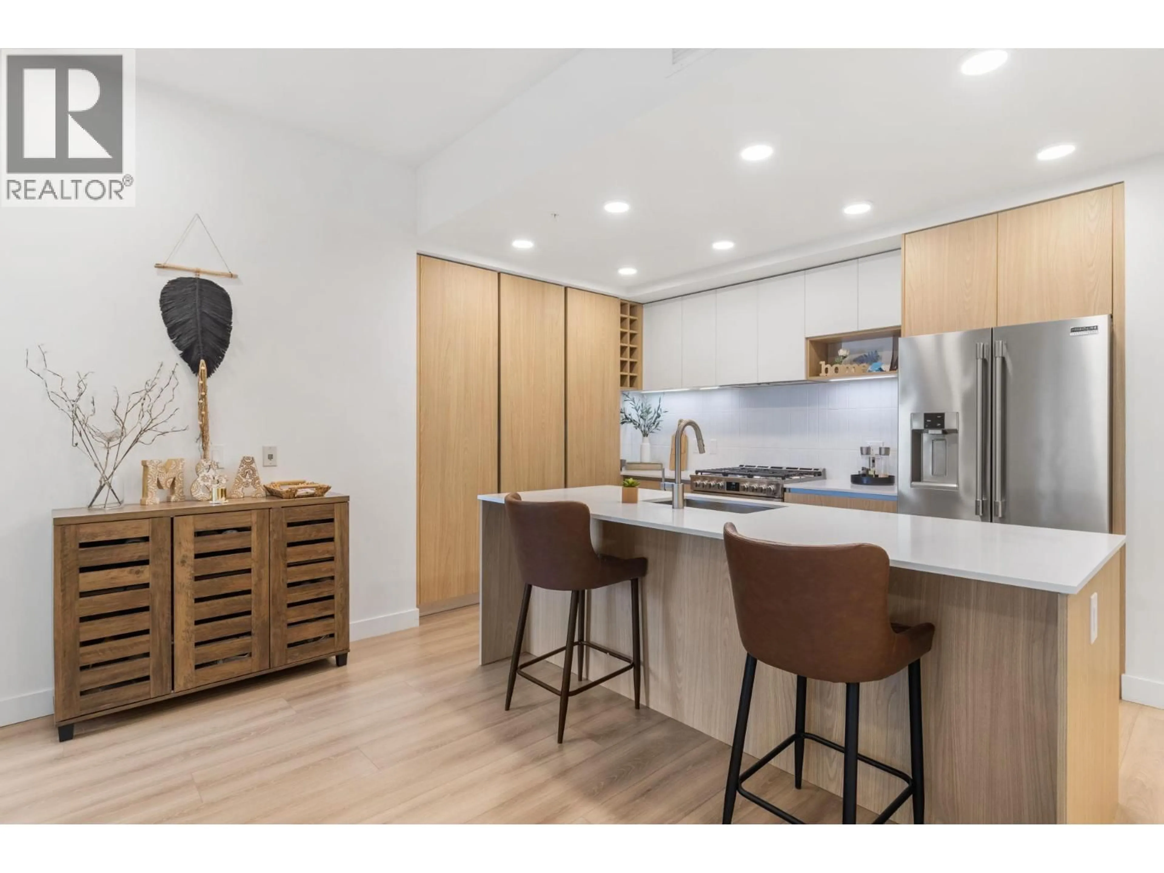 Open concept kitchen, wood/laminate floor for 101 - 2780 OLALLA ROAD, West Kelowna British Columbia V1Z2A9