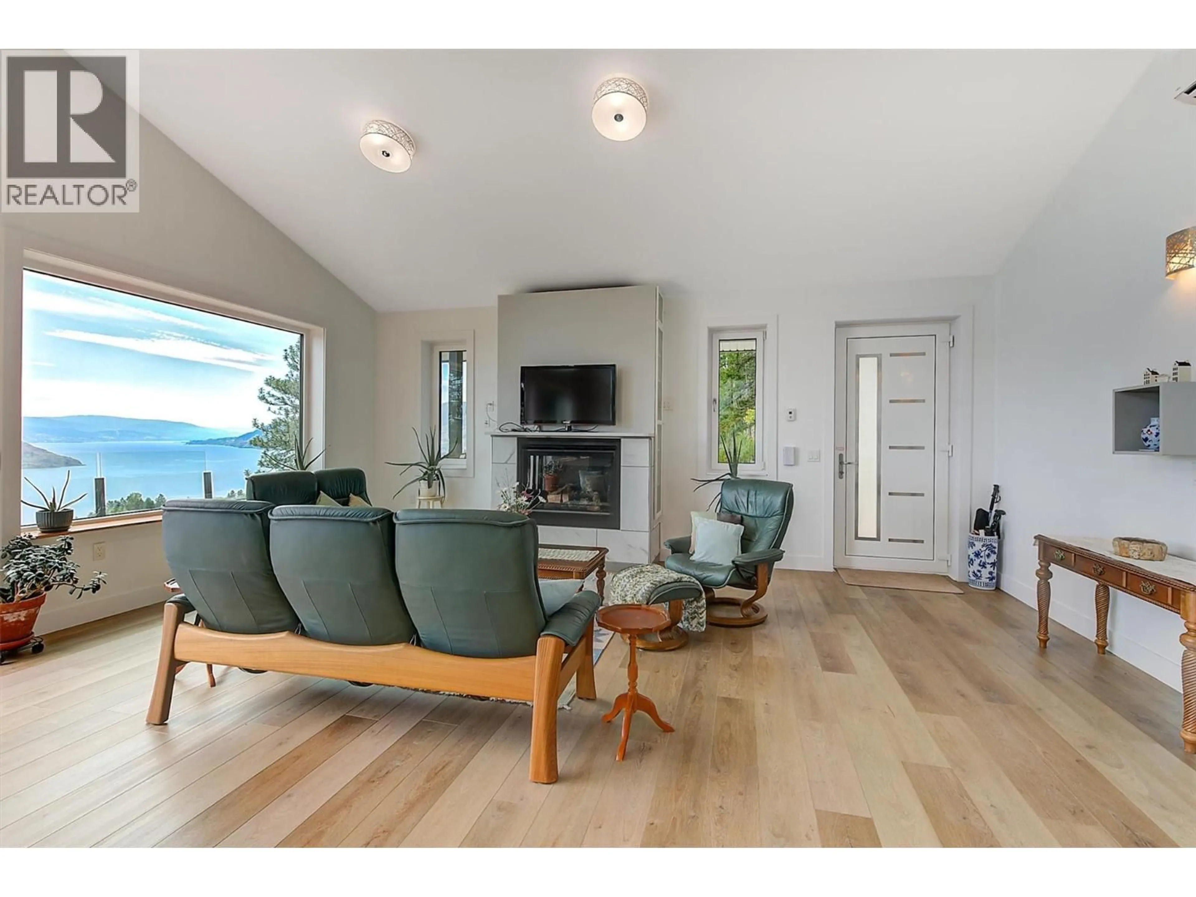 Living room with furniture, wood/laminate floor for 6131 SEYMOURE LANE, Peachland British Columbia V0H1X4