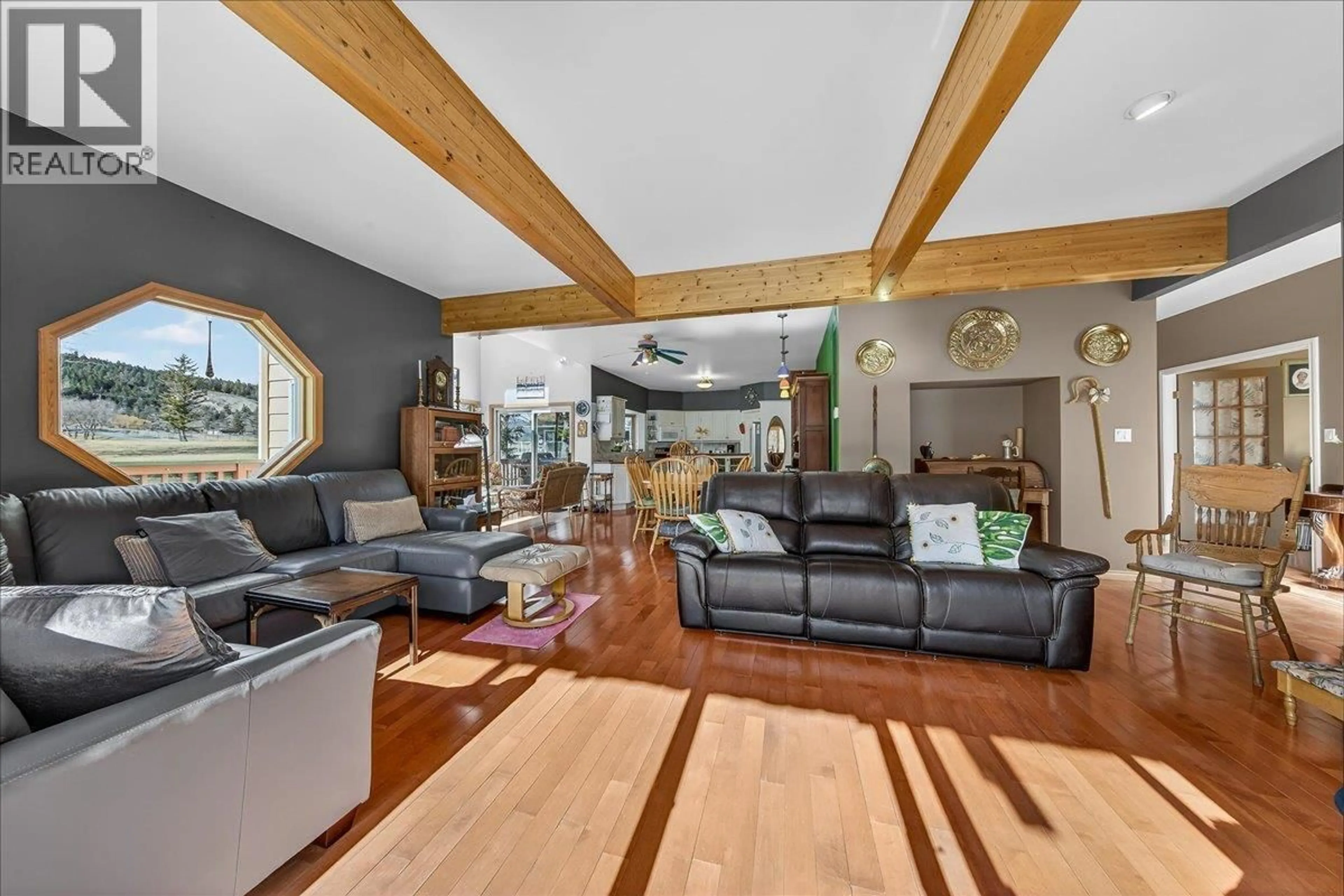 Living room with furniture, wood/laminate floor for 4529 COLUMBIA PLACE, Fairmont Hot Springs British Columbia V0B1L2