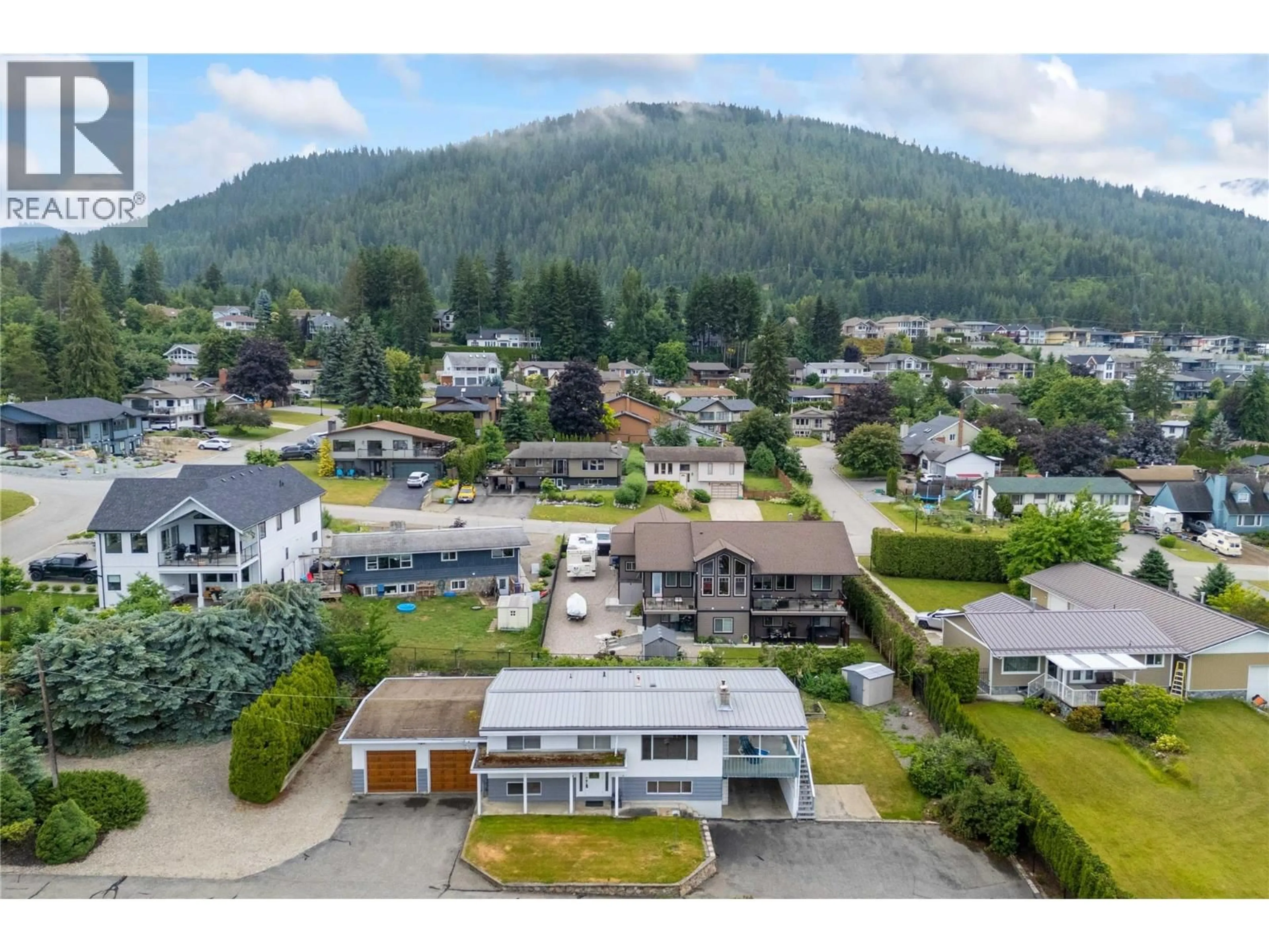 A pic from outside/outdoor area/front of a property/back of a property/a pic from drone, mountain view for 1431 15 STREET SOUTHEAST, Salmon Arm British Columbia V1E2G8