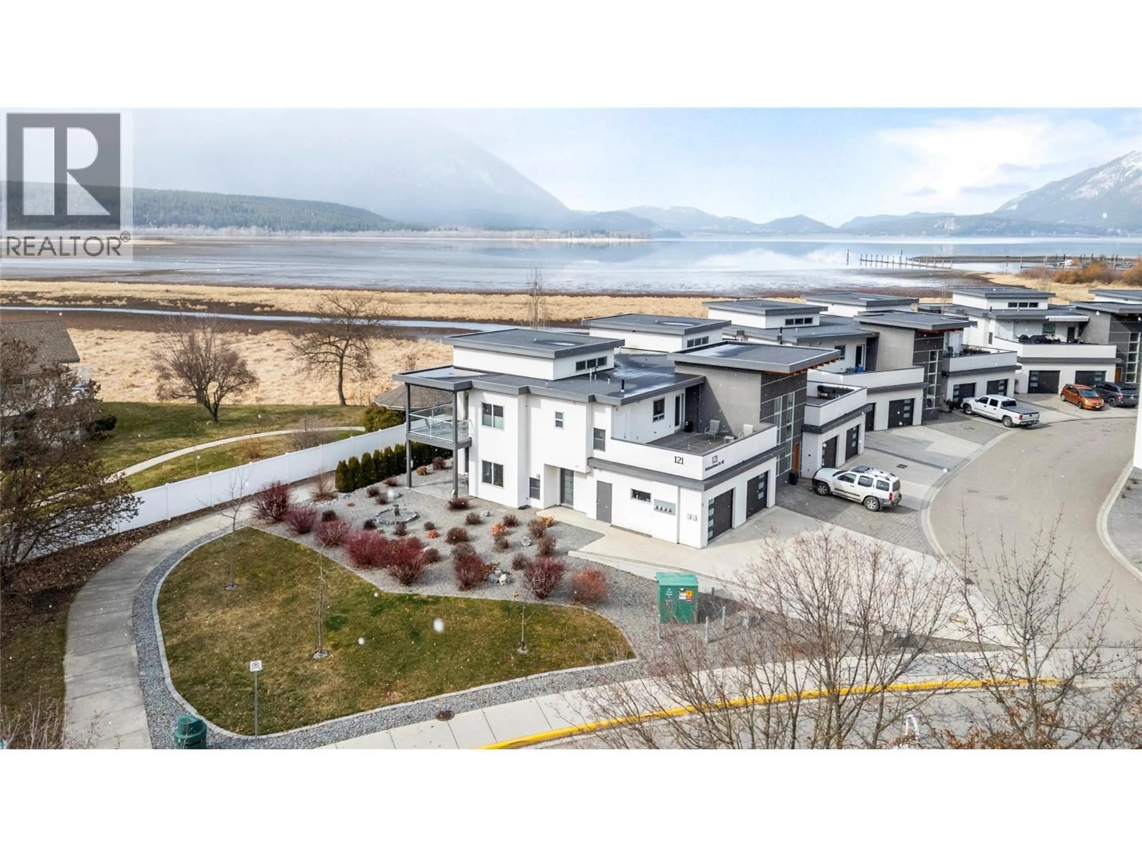 A pic from outside/outdoor area/front of a property/back of a property/a pic from drone, water/lake/river/ocean view for 1 - 121 HARBOURFRONT DRIVE NORTHEAST, Salmon Arm British Columbia V1E2T3