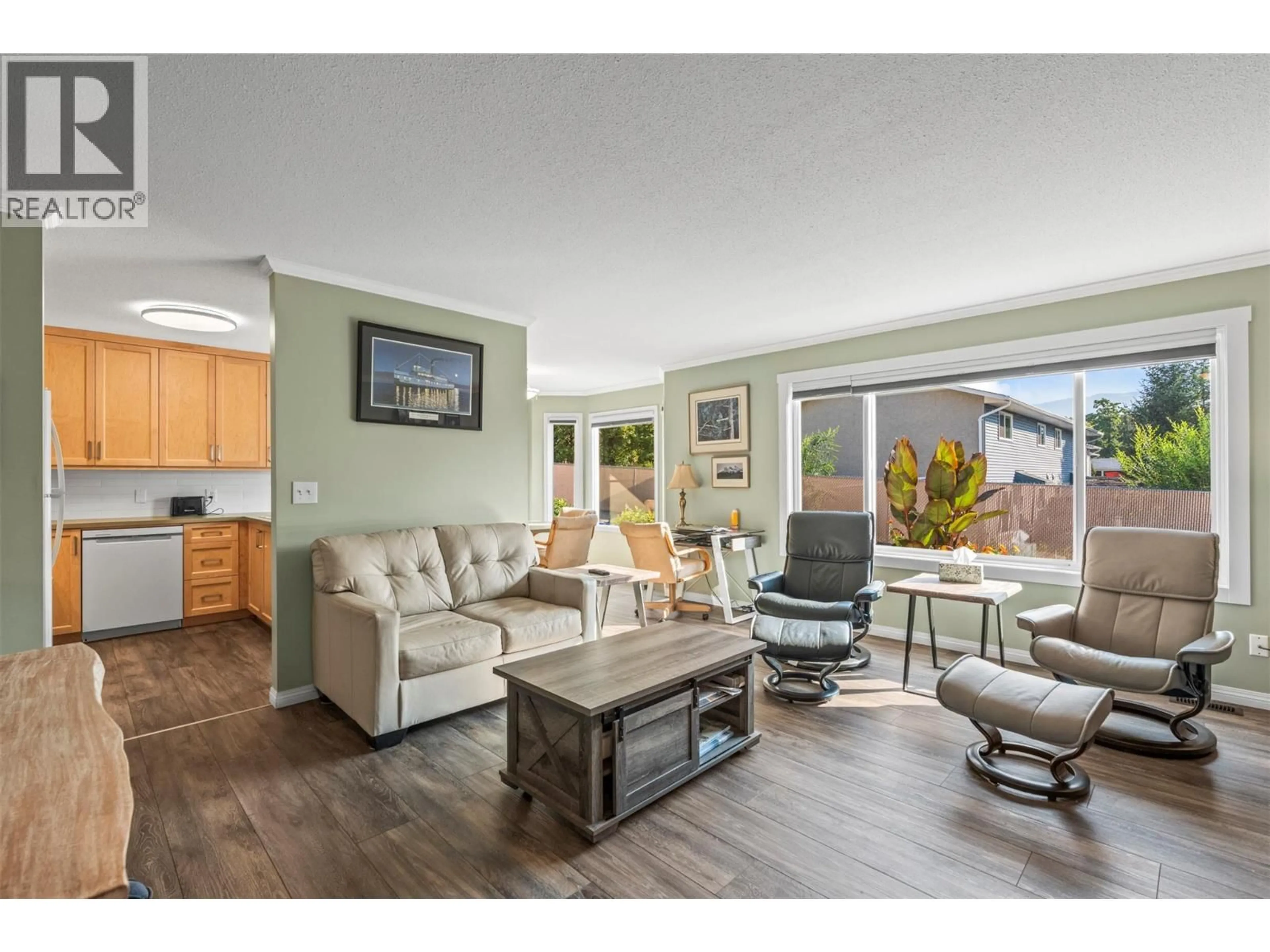 Living room with furniture, wood/laminate floor for 35 - 4600 BELLA VISTA ROAD, Vernon British Columbia V1T2N4
