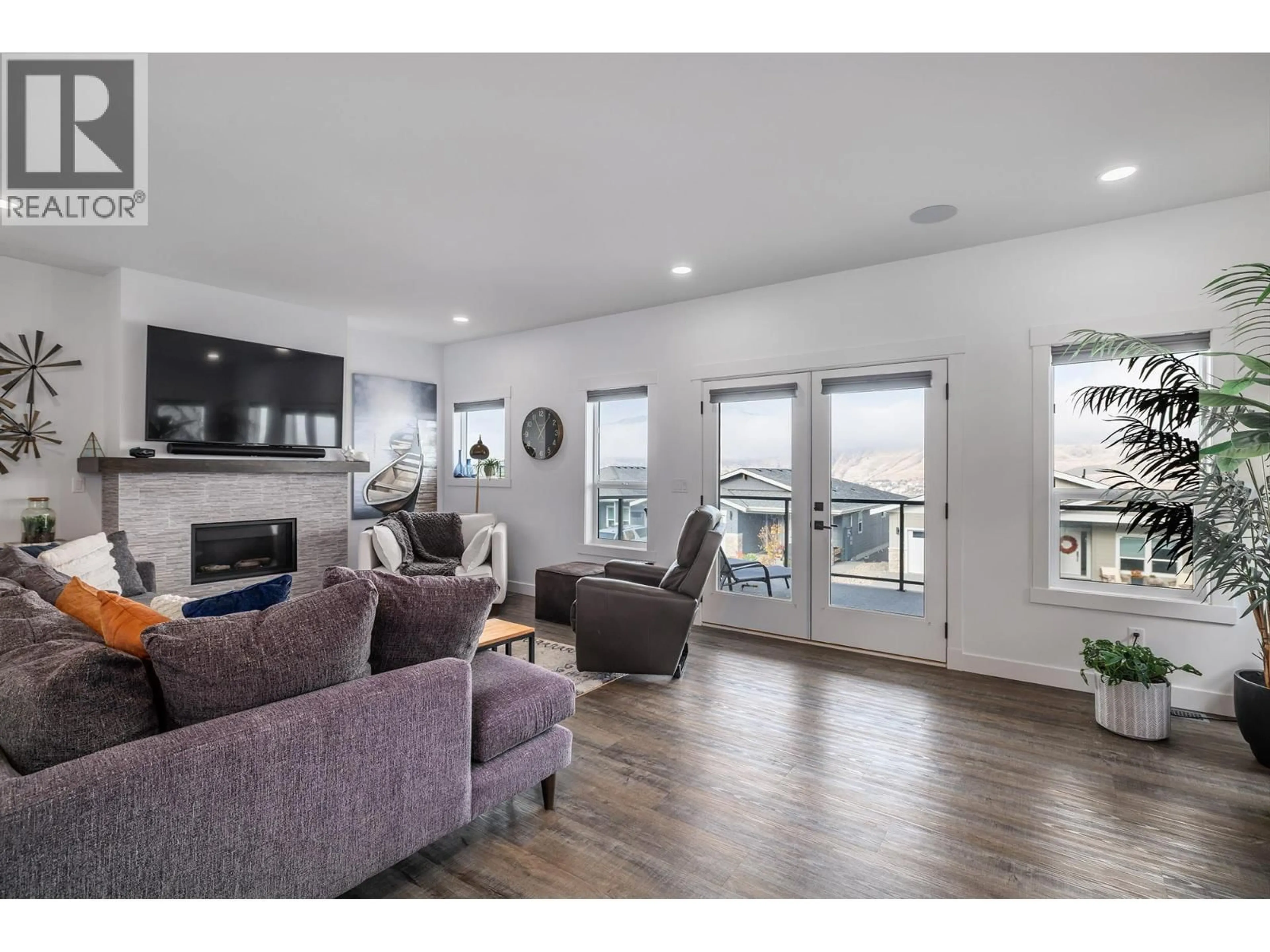 Living room with furniture, wood/laminate floor for 125 - 7760 OKANAGAN LANDING ROAD, Vernon British Columbia V1H1Z4