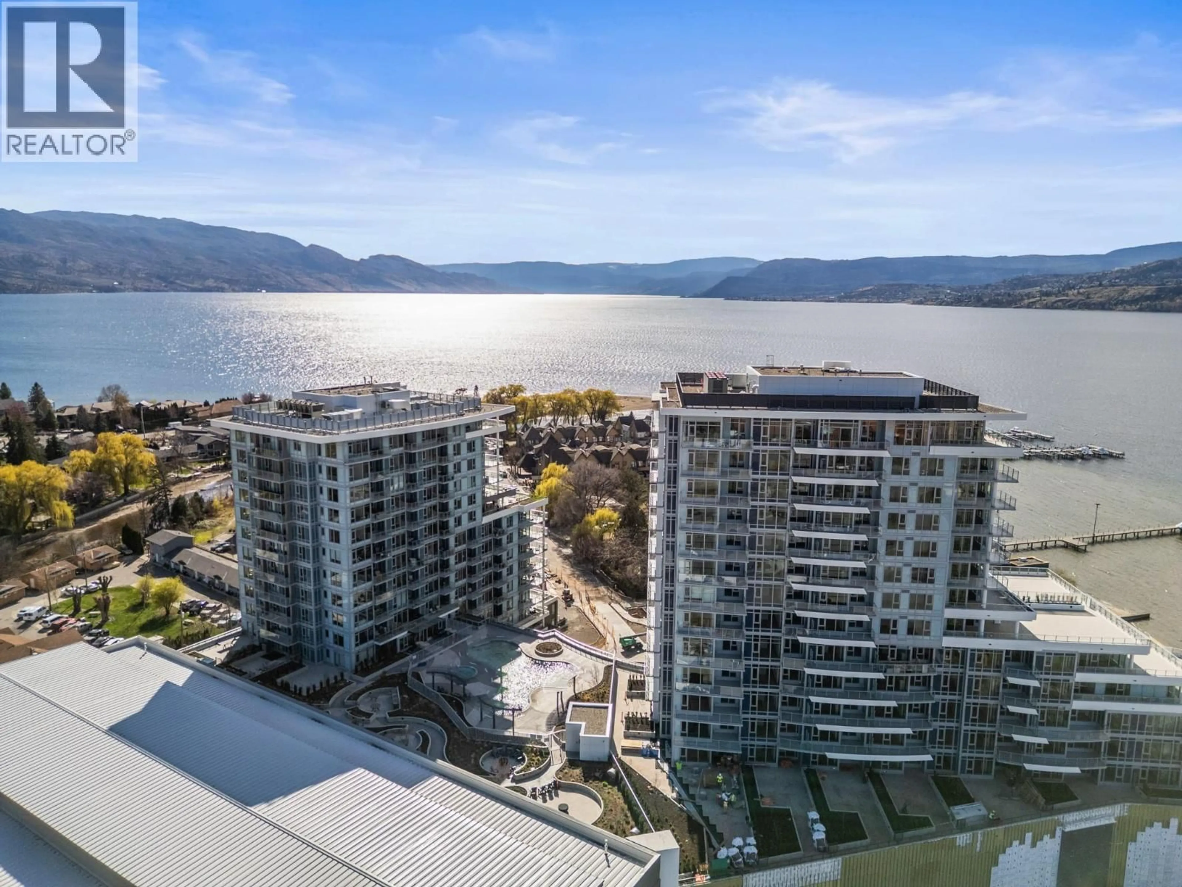 A pic from outside/outdoor area/front of a property/back of a property/a pic from drone, water/lake/river/ocean view for 601 - 3699 CAPOZZI ROAD, Kelowna British Columbia V1W3L2