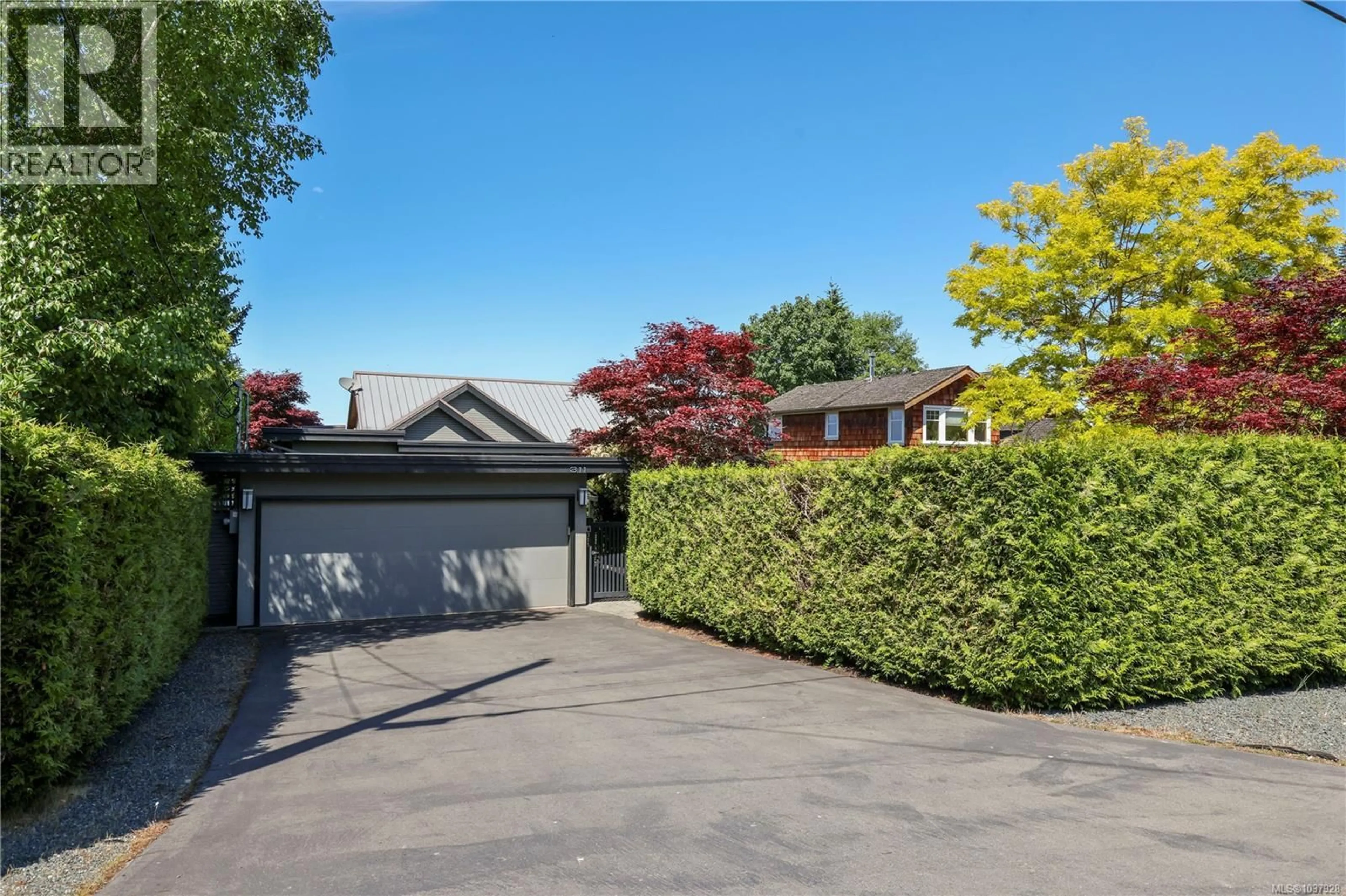A pic from outside/outdoor area/front of a property/back of a property/a pic from drone, street for 311 POPLAR AVENUE, Qualicum Beach British Columbia V9K1J7