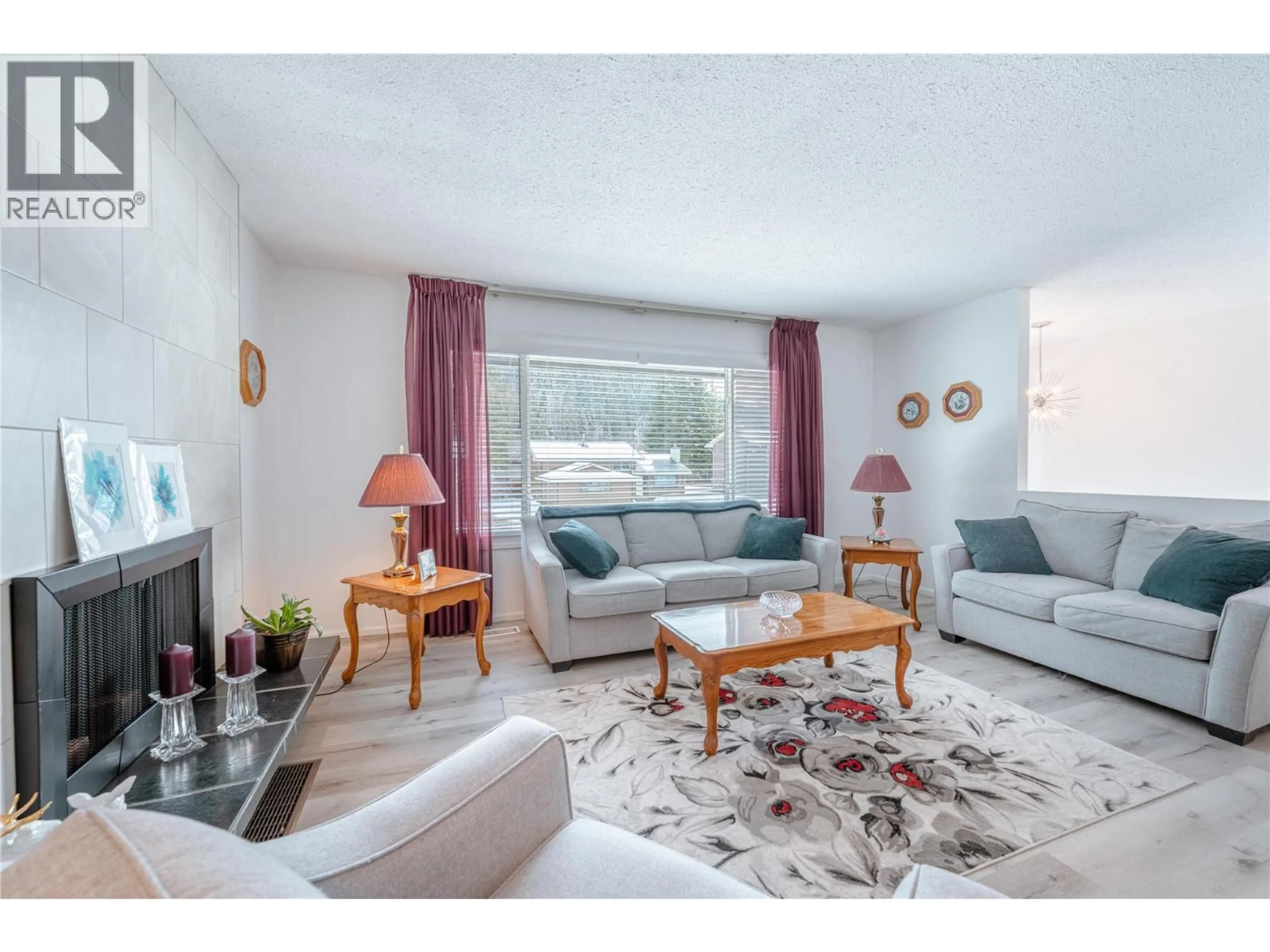 Living room with furniture, wood/laminate floor for 361 PEARKES DRIVE, Revelstoke British Columbia V0E2S0