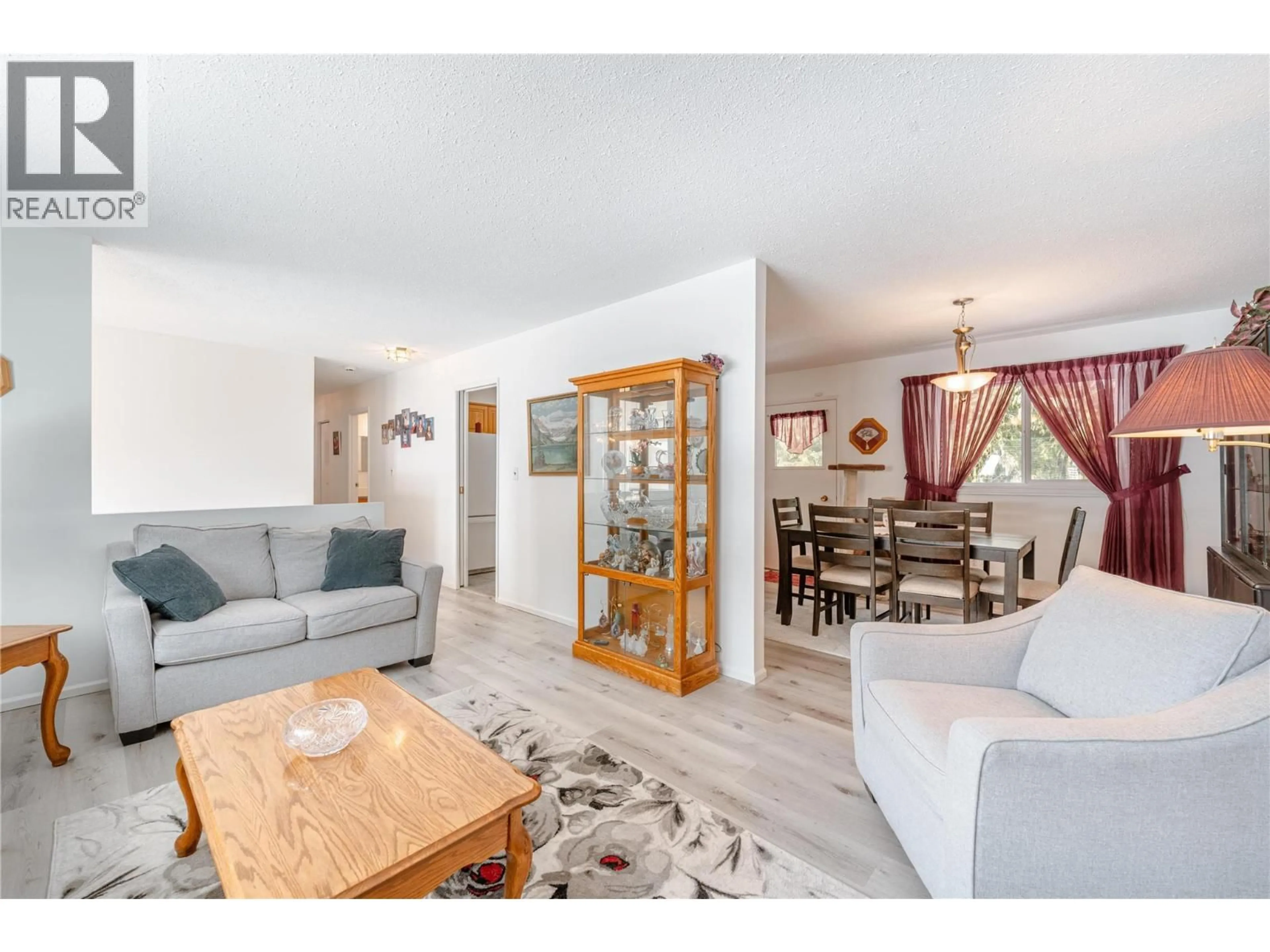 Living room with furniture, wood/laminate floor for 361 PEARKES DRIVE, Revelstoke British Columbia V0E2S0