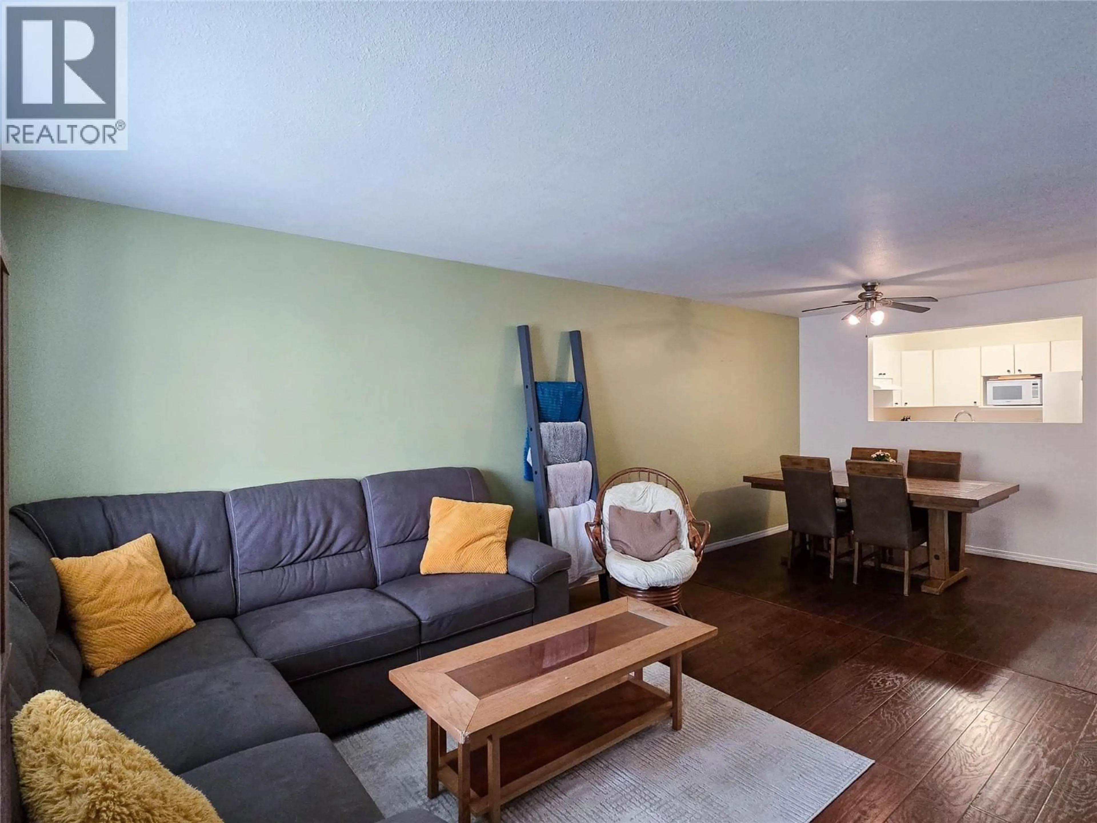 Living room with furniture, wood/laminate floor for 208 - 110 KALAMALKA LAKE ROAD, Vernon British Columbia V1T7M3