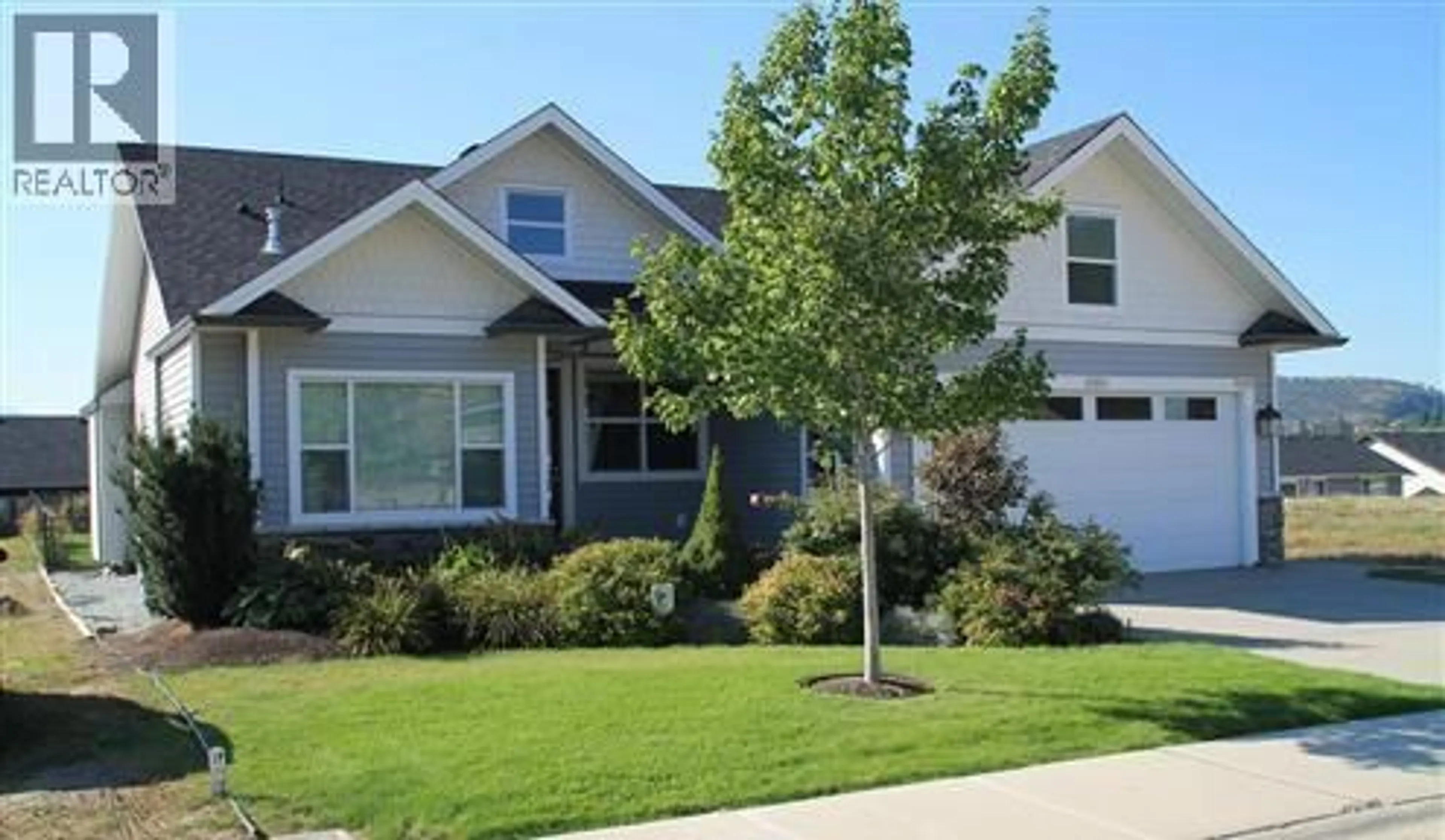 Home with vinyl exterior material, street for 337 ARAB ROAD, Kelowna British Columbia V1V3A8