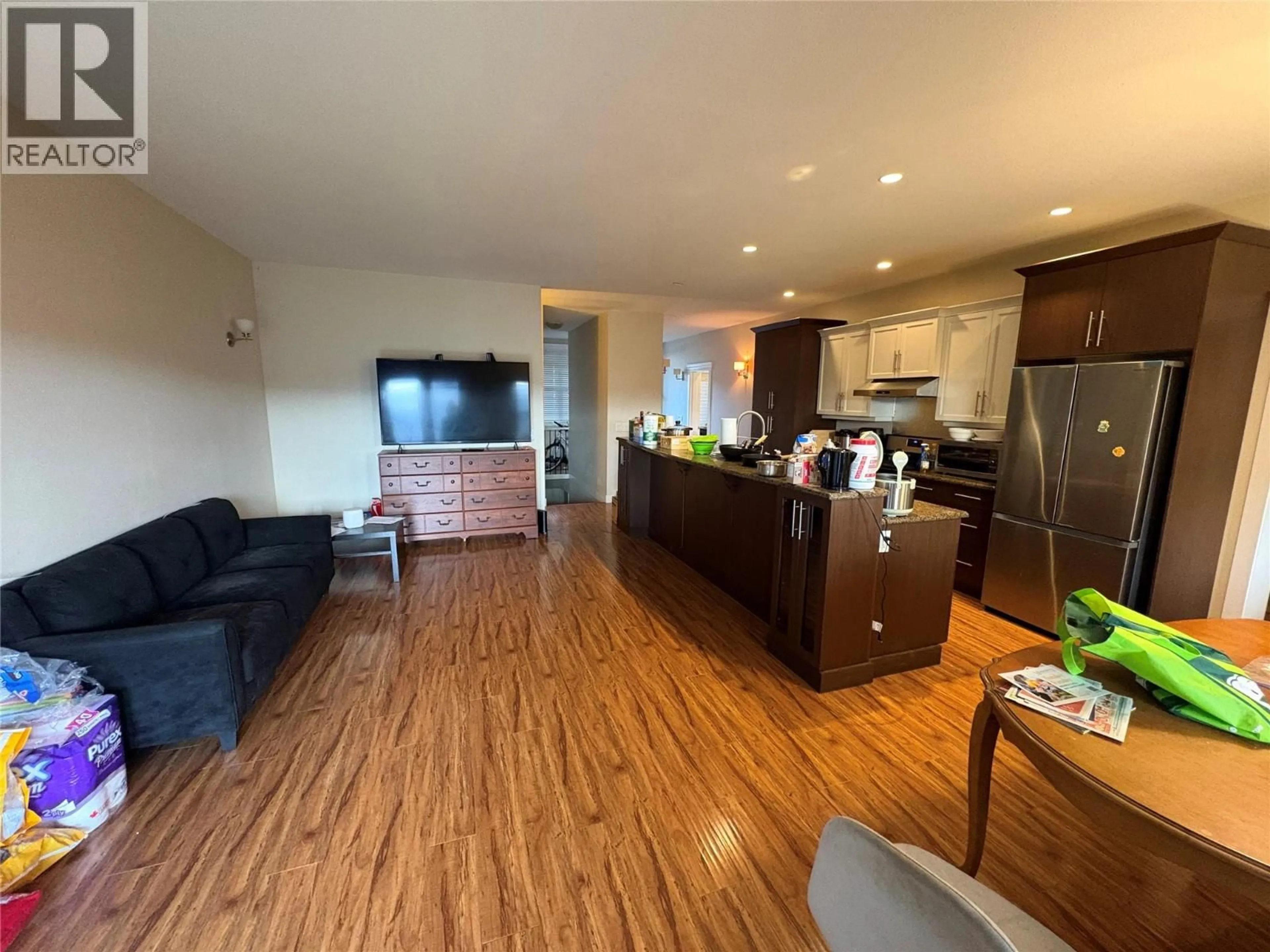 Open concept kitchen, wood/laminate floor for 337 ARAB ROAD, Kelowna British Columbia V1V3A8