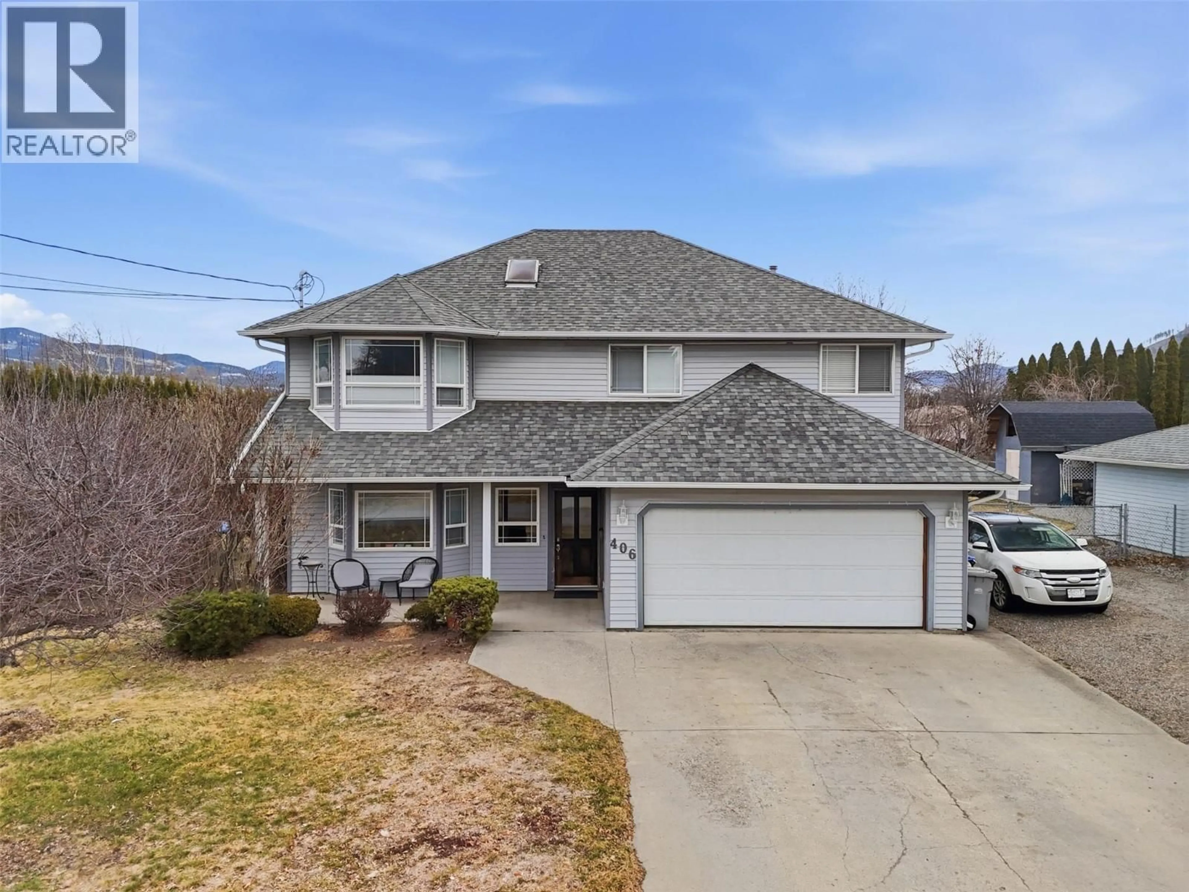 A pic from outside/outdoor area/front of a property/back of a property/a pic from drone, street for 406 CHILCO AVENUE, Kamloops British Columbia V2H1L9